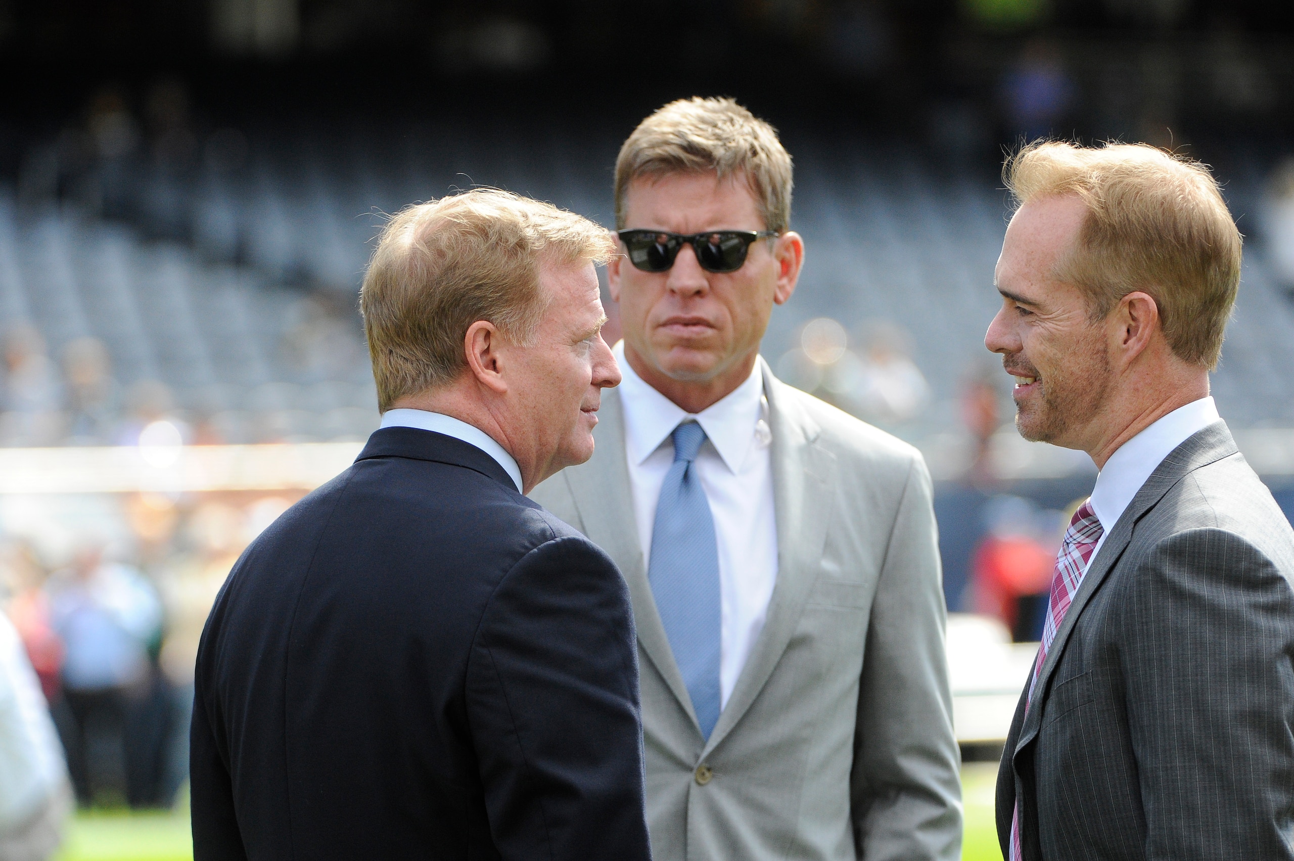 CHICAGO, IL- SEPTEMBER 13: NFL Commissioner Roger Goodell (L) talks to Troy Aikman (C) and Joe Buck (R) on the field before the game between the Chicago Bears and the Green Bay Packers on September 13, 2015 at Soldier Field in Chicago, Illinois.  (Photo by David Banks/Getty Images) 