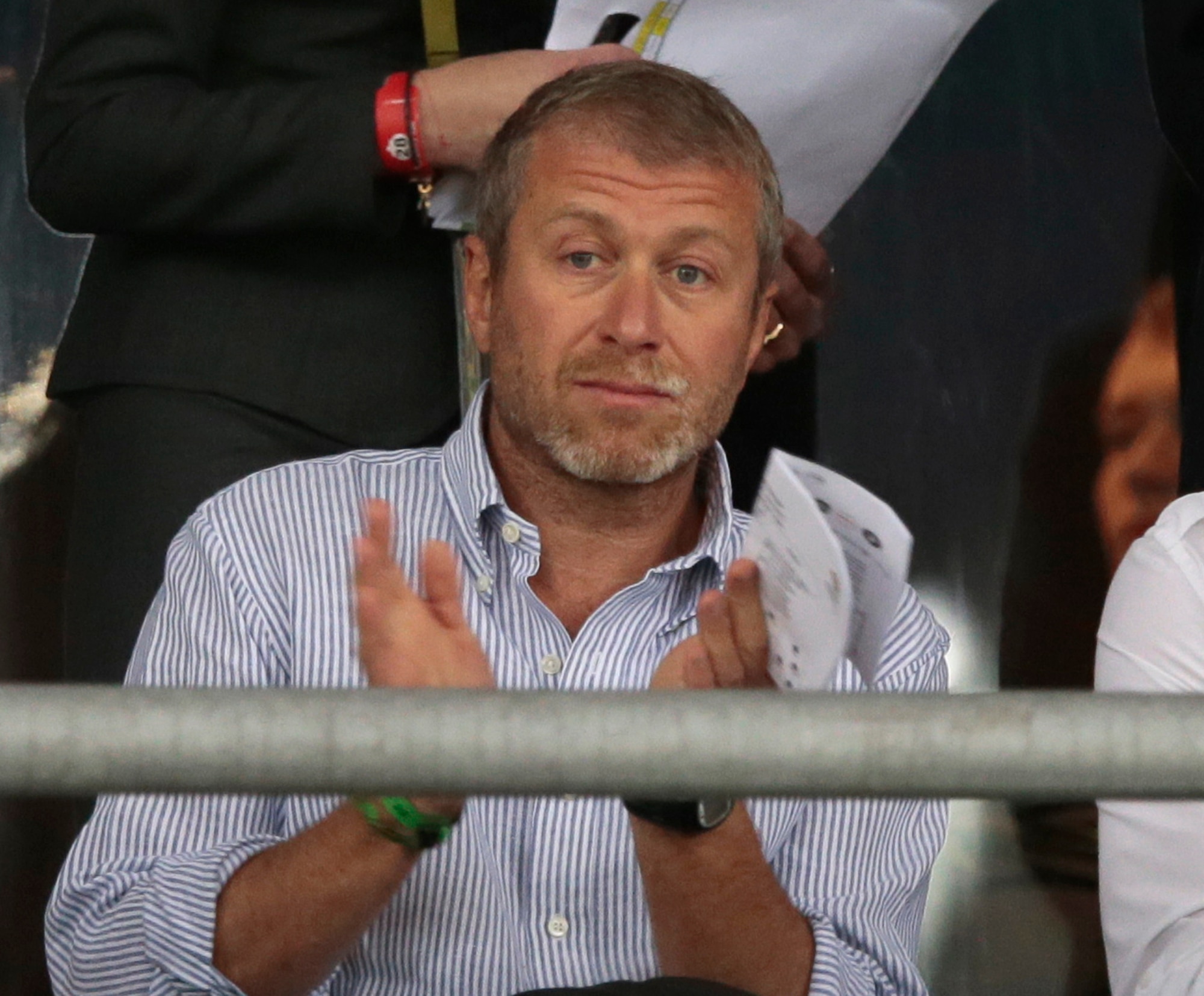 Chlelsea owner Roman Abramovich applauds during the Euro 2012 soccer championship quarterfinal match between England and Italy in Kiev, Ukraine, Sunday, June 24, 2012. (AP Photo/Ivan Sekretarev)