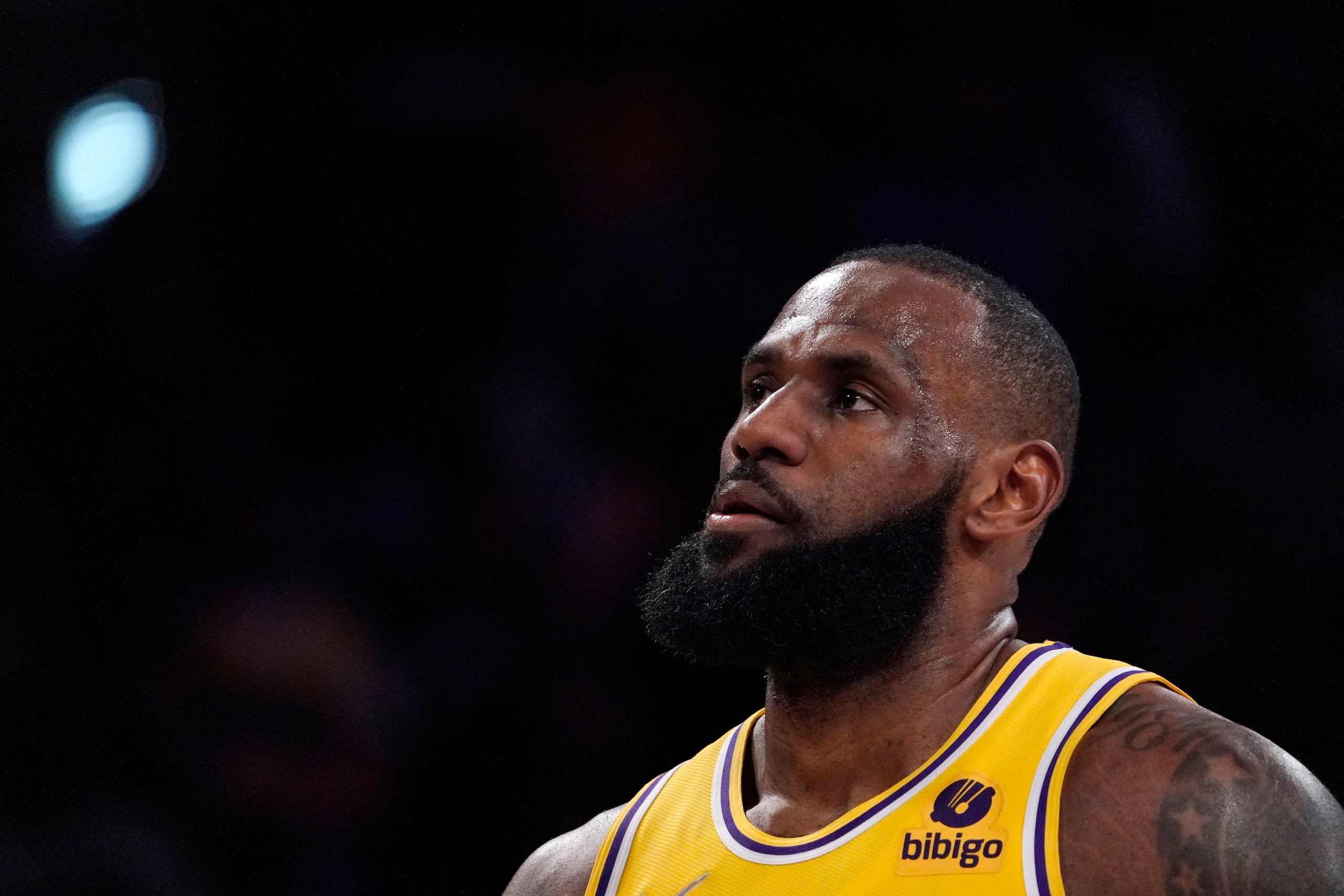 Los Angeles Lakers forward LeBron James stands on the court during the first half of an NBA basketball game against the Dallas Mavericks Tuesday, March 1, 2022, in Los Angeles. (AP Photo/Mark J. Terrill)