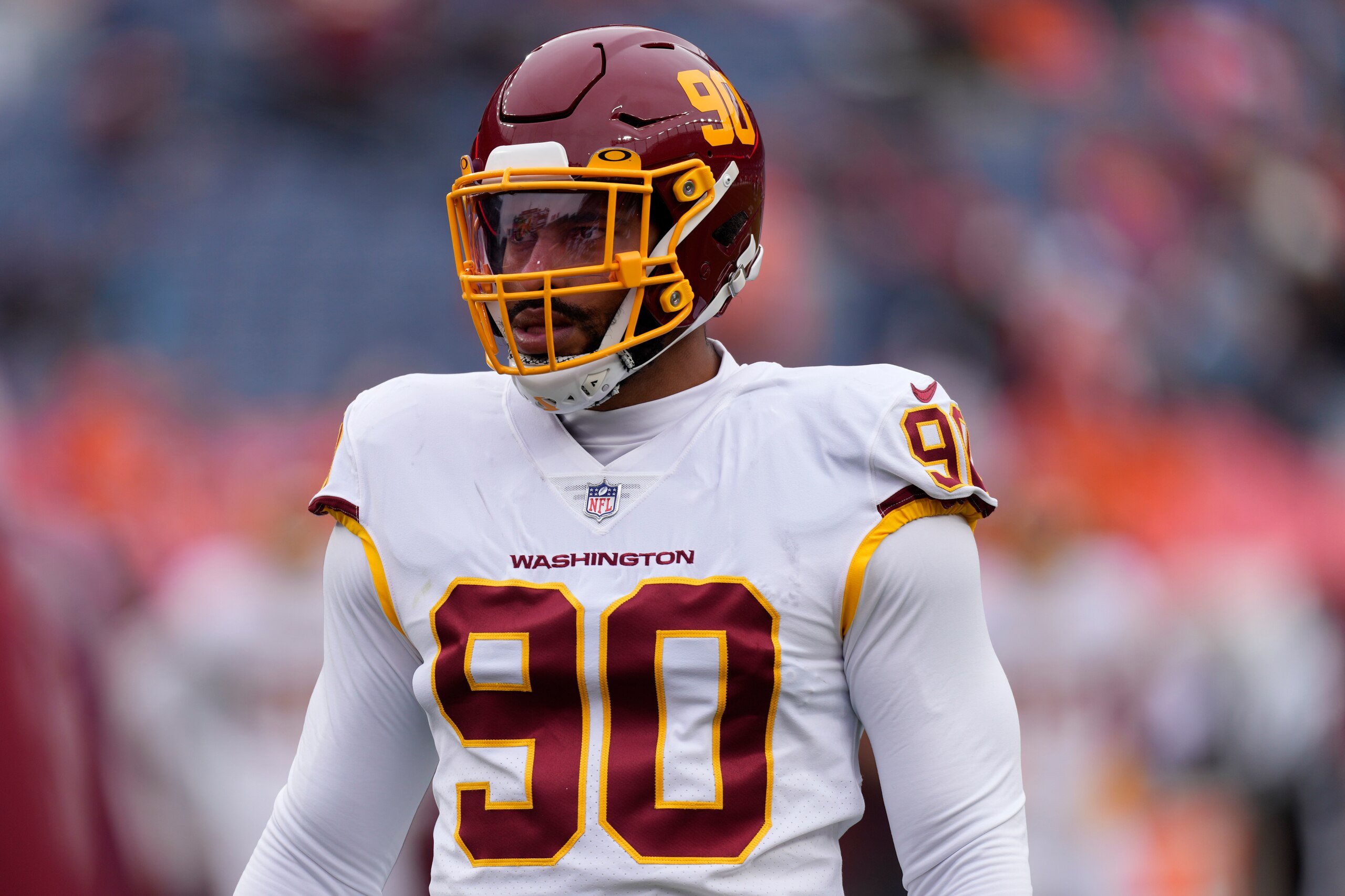 Washington Football Team defensive end Montez Sweat (90) prior to an NFL football game against the Denver Broncos, Sunday, Oct. 31, 2021, in Denver. (AP Photo/David Zalubowski)