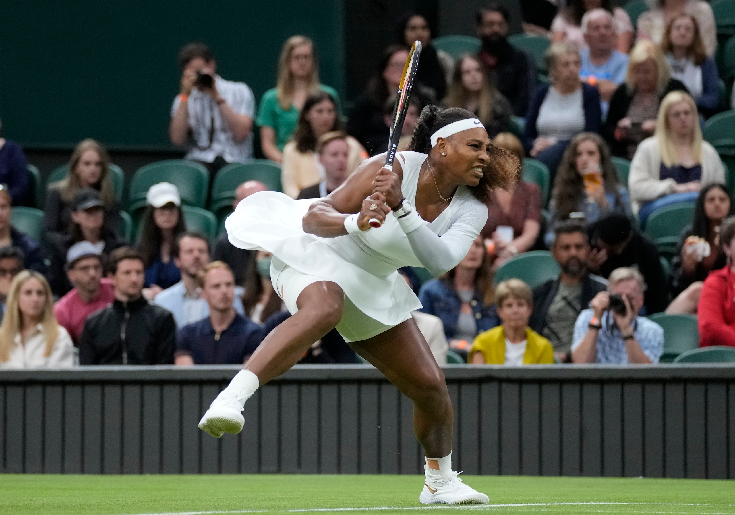 Serena Williams of the US plays a return to Aliaksandra Sasnovich of Belarus during the women's singles first round match on day two of the Wimbledon Tennis Championships in London, Tuesday June 29, 2021. (AP Photo/Kirsty Wigglesworth)