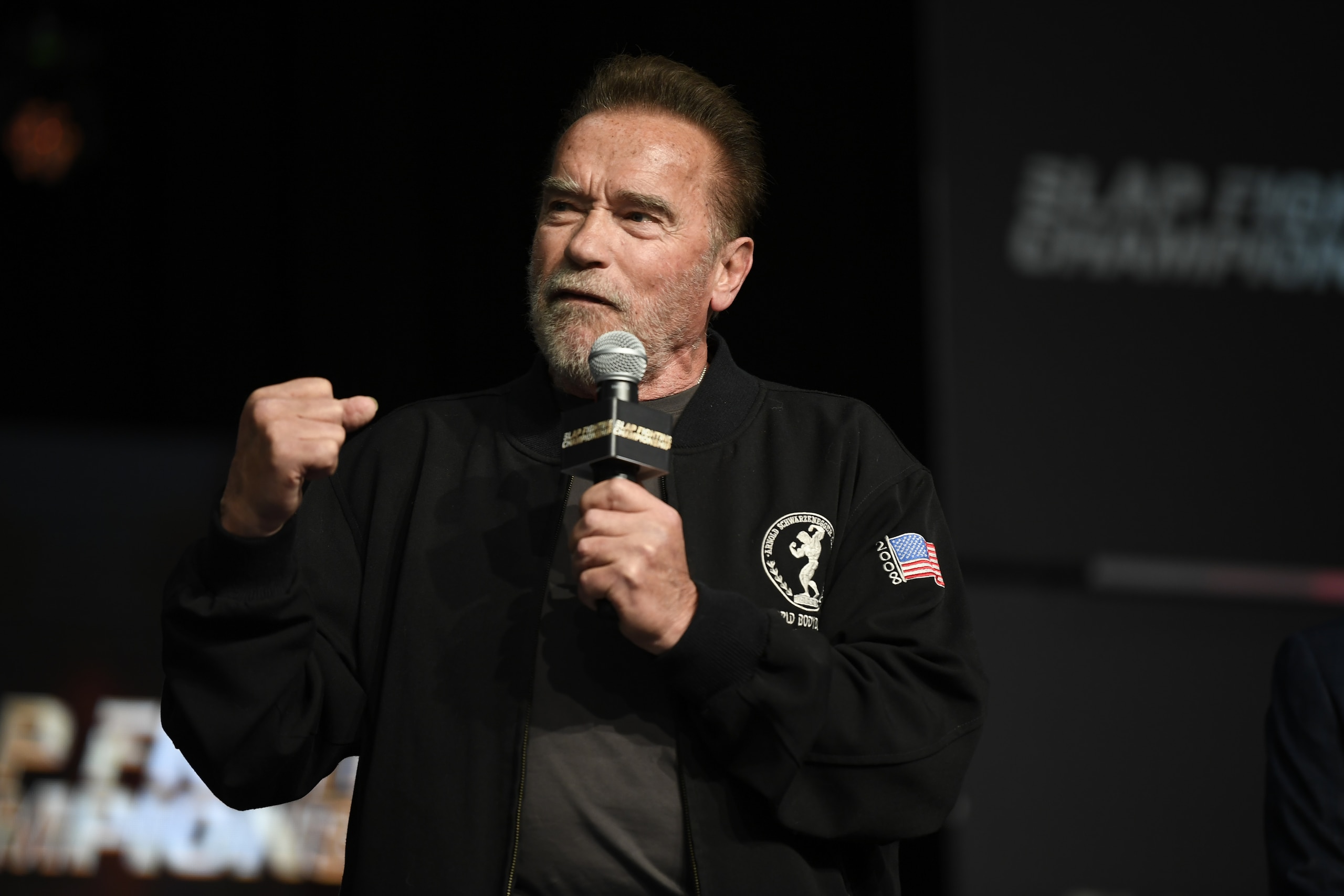 COLUMBUS, OHIO - MARCH 05:  Arnold Schwarzenegger speaks to fans during the Slap Fighting Championships at the Arnold Sports Festival in Columbus Convention Center on March 05, 2022 in Columbus, Ohio. (Photo by Gaelen Morse/Getty Images)