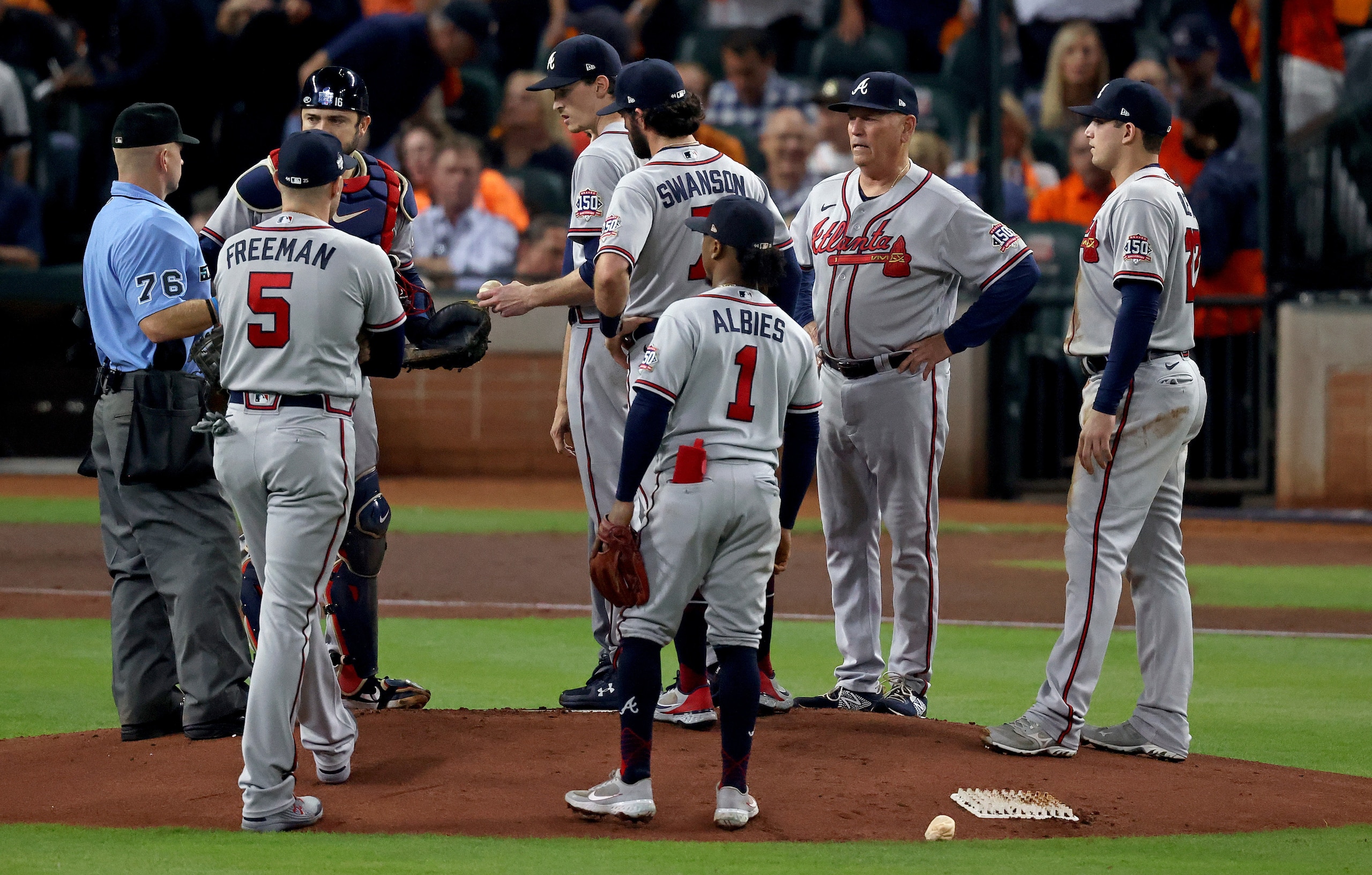 HOUSTON, TEXAS - NOVEMBER 02:  Max Fried #54 of the Atlanta Braves receives a mound visit after tripping and committing a fielding error against the Houston Astros during the first inning in Game Six of the World Series at Minute Maid Park on November 02, 2021 in Houston, Texas. (Photo by Tom Pennington/Getty Images)