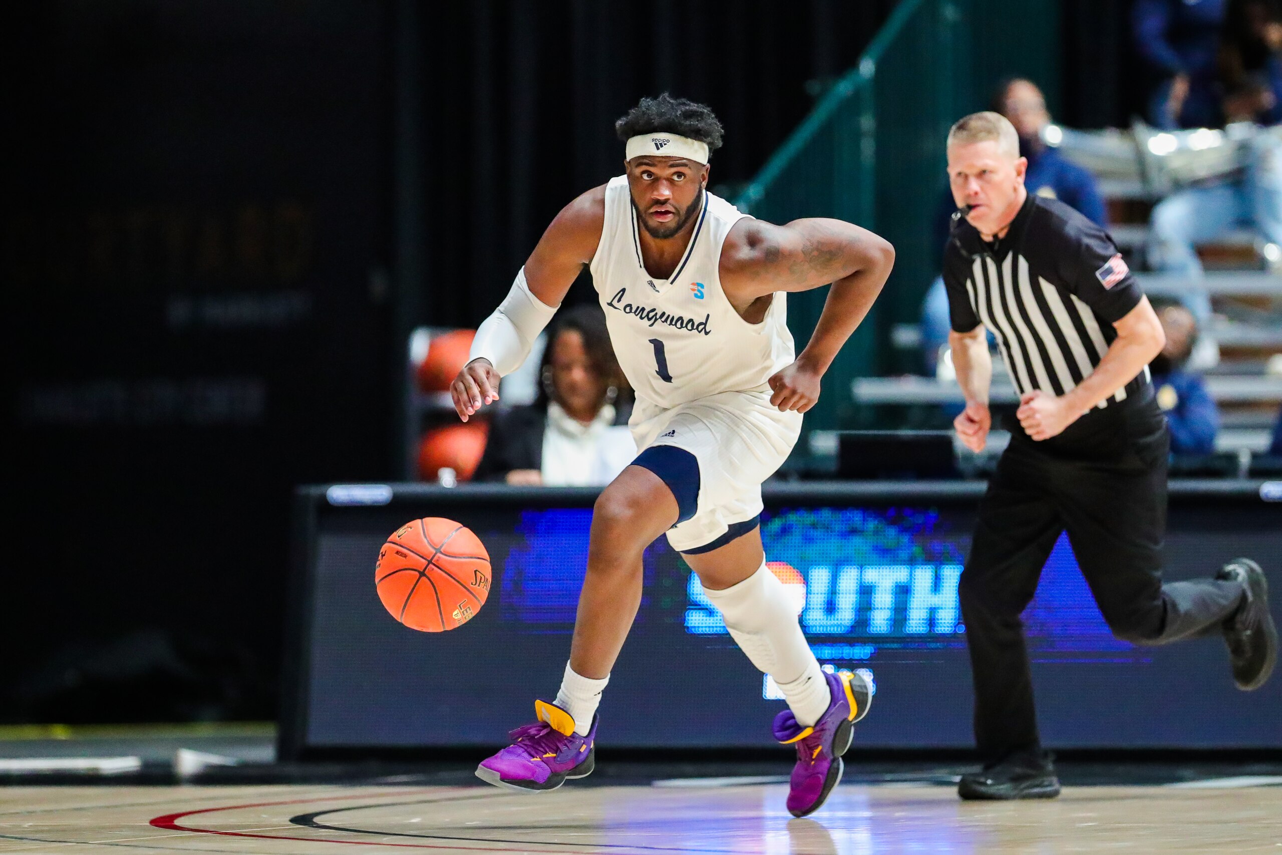 CHARLOTTE, NC - MARCH 04: Isaiah Wilkins (1) of the Longwood Lancers brings the ball down the court during the Big South Tournament between the Longwood Lancers and the North Carolina A&T Aggies on March 4, 2022, at Bojangles Coliseum in Charlotte, NC. (Photo by David Jensen/Icon Sportswire via Getty Images)