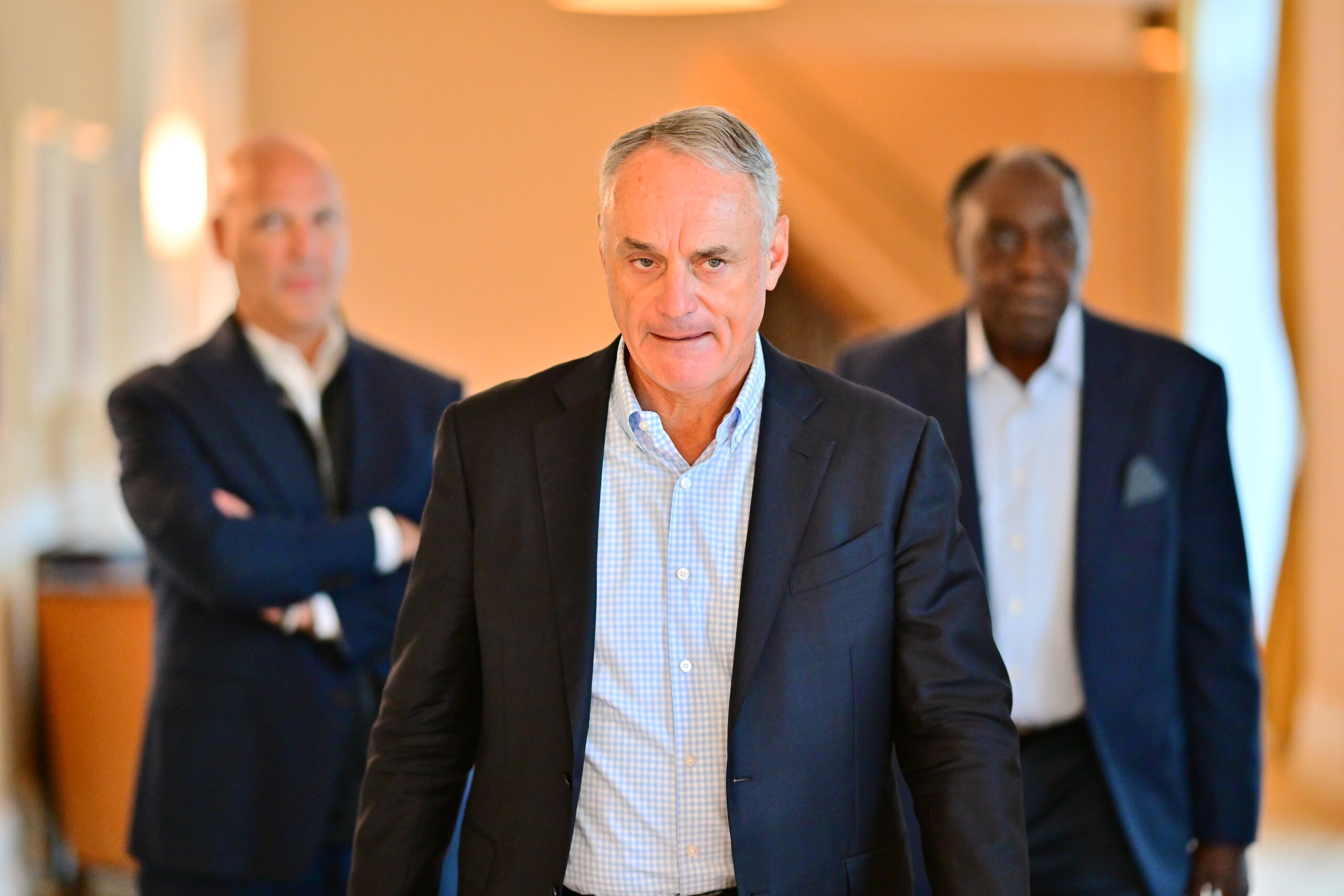 ORLANDO, FLORIDA - FEBRUARY 10: Major League Baseball Commissioner Rob Manfred walks to a press conference during an MLB owner's meeting at the Waldorf Astoria on February 10, 2022 in Orlando, Florida. Manfred addressed the ongoing lockout of players, which owners put in place after the league's collective bargaining agreement ended on December 1, 2021. (Photo by Julio Aguilar/Getty Images)