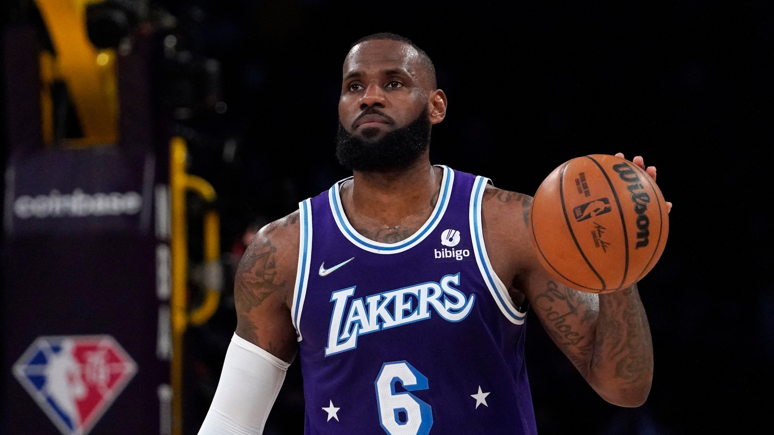 Los Angeles Lakers forward LeBron James dribbles during the second half of an NBA basketball game against the Los Angeles Clippers Friday, Feb. 25, 2022, in Los Angeles. (AP Photo/Mark J. Terrill)