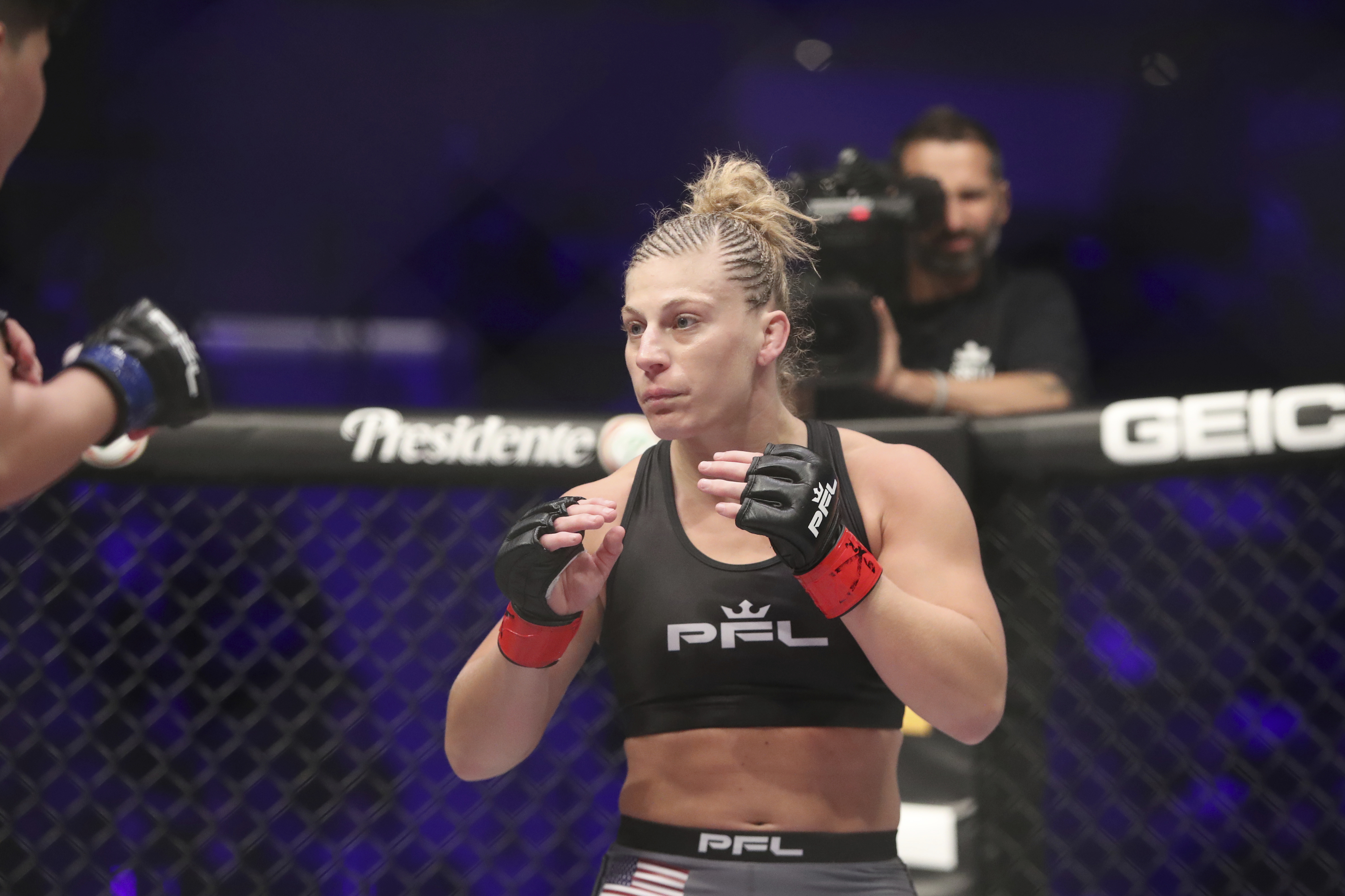 Kayla Harrison, right, in action against Larissa Pacheco during their regular season mixed martial arts bout at PFL 1, Thursday, May 9, 2019, at the Nassau Coliseum (NYCB Live) in Uniondale, NY. Harrison won via unanimous decision. (AP Photo/Gregory Payan)