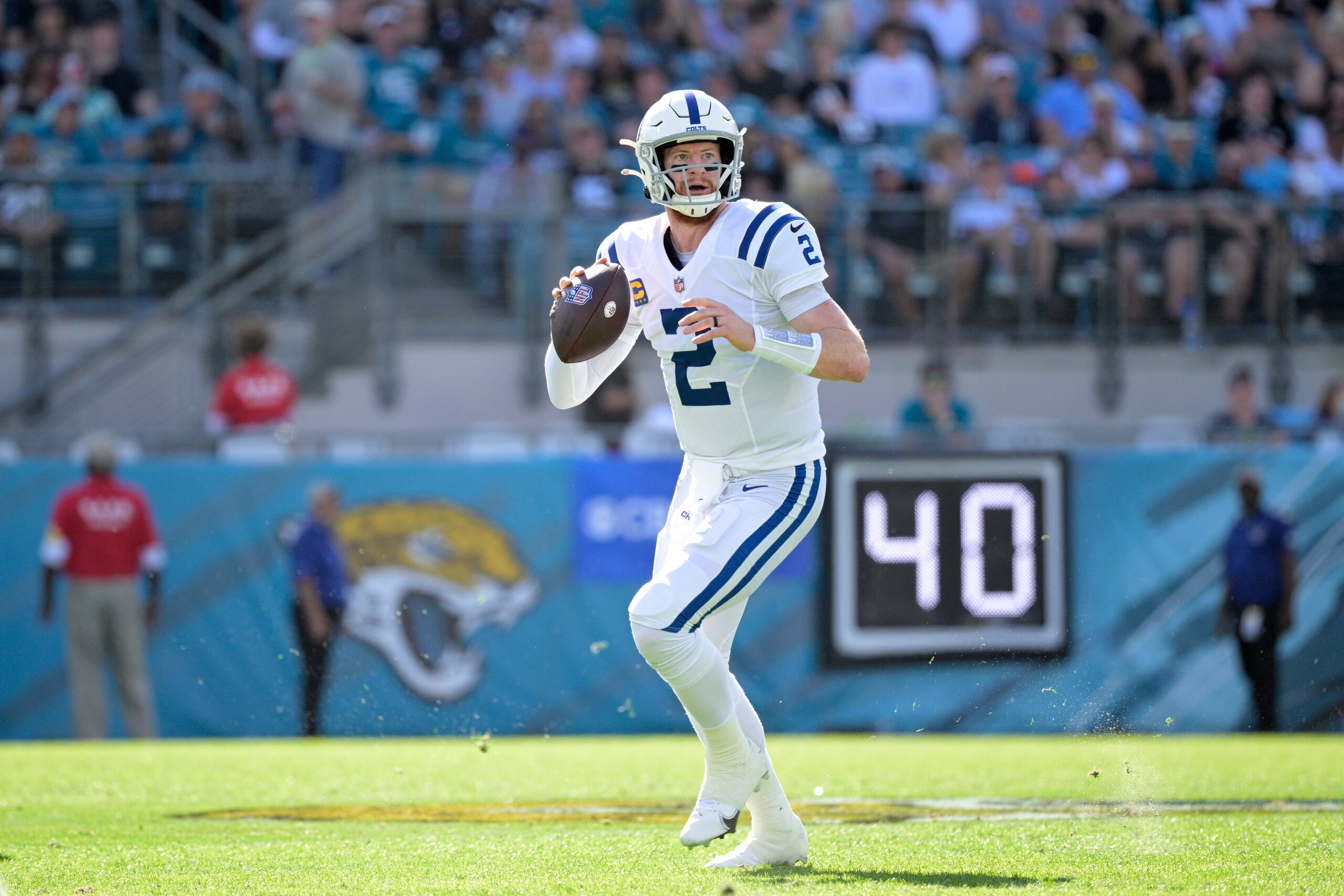 Indianapolis Colts quarterback Carson Wentz (2) looks for a receiver during the first half of an NFL football game against the Jacksonville Jaguars, Sunday, Jan. 9, 2022, in Jacksonville, Fla. (AP Photo/Phelan M. Ebenhack)