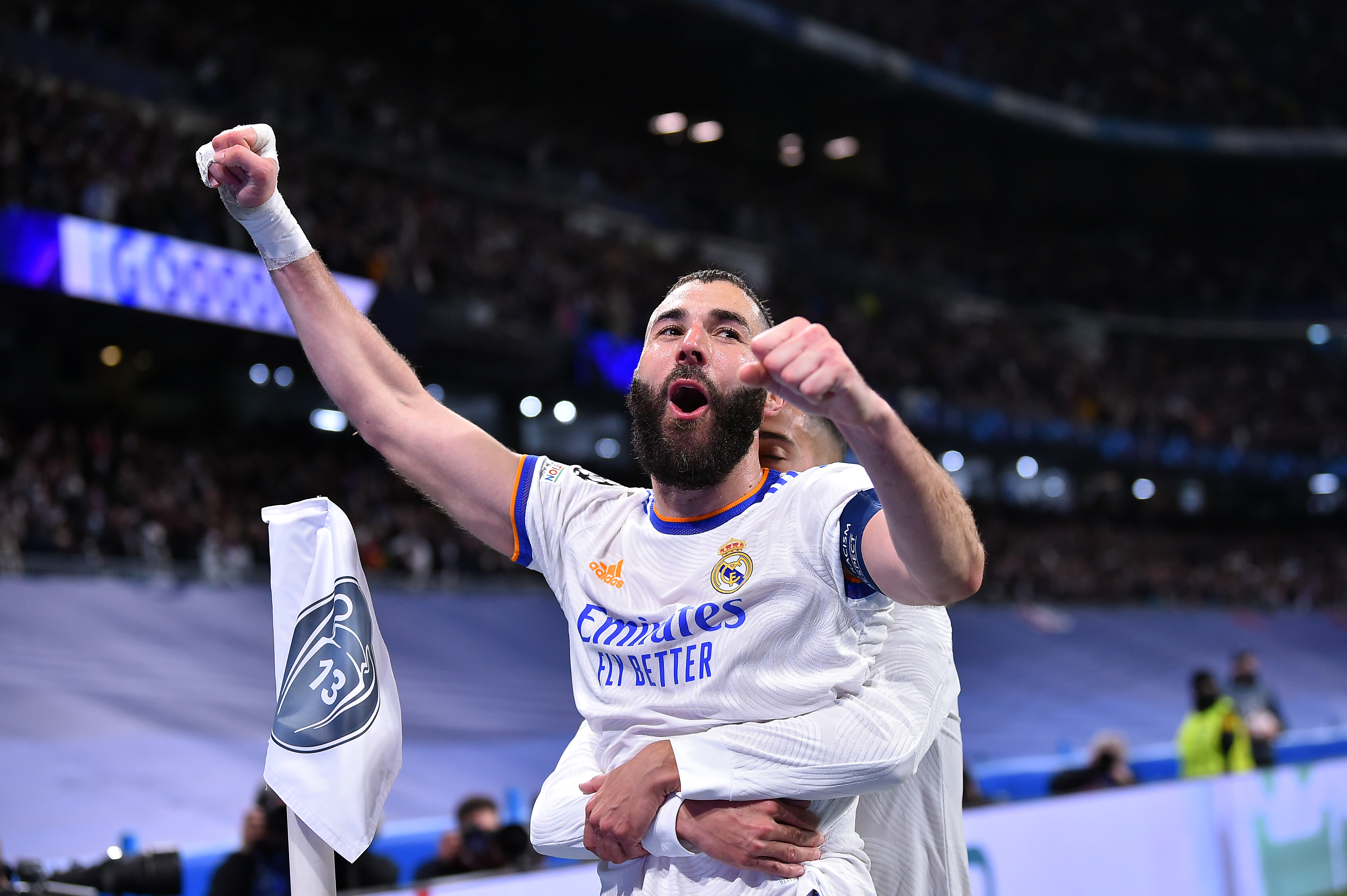 MADRID, SPAIN - MARCH 09: Karim Benzama of Real Madrid reacts after scoring during the UEFA Champions League Round Of Sixteen Leg Two match between Real Madrid and Paris Saint-Germain at Estadio Santiago Bernabeu on March 09, 2022 in Madrid, Spain. (Photo by Aurelien Meunier - PSG/PSG via Getty Images)