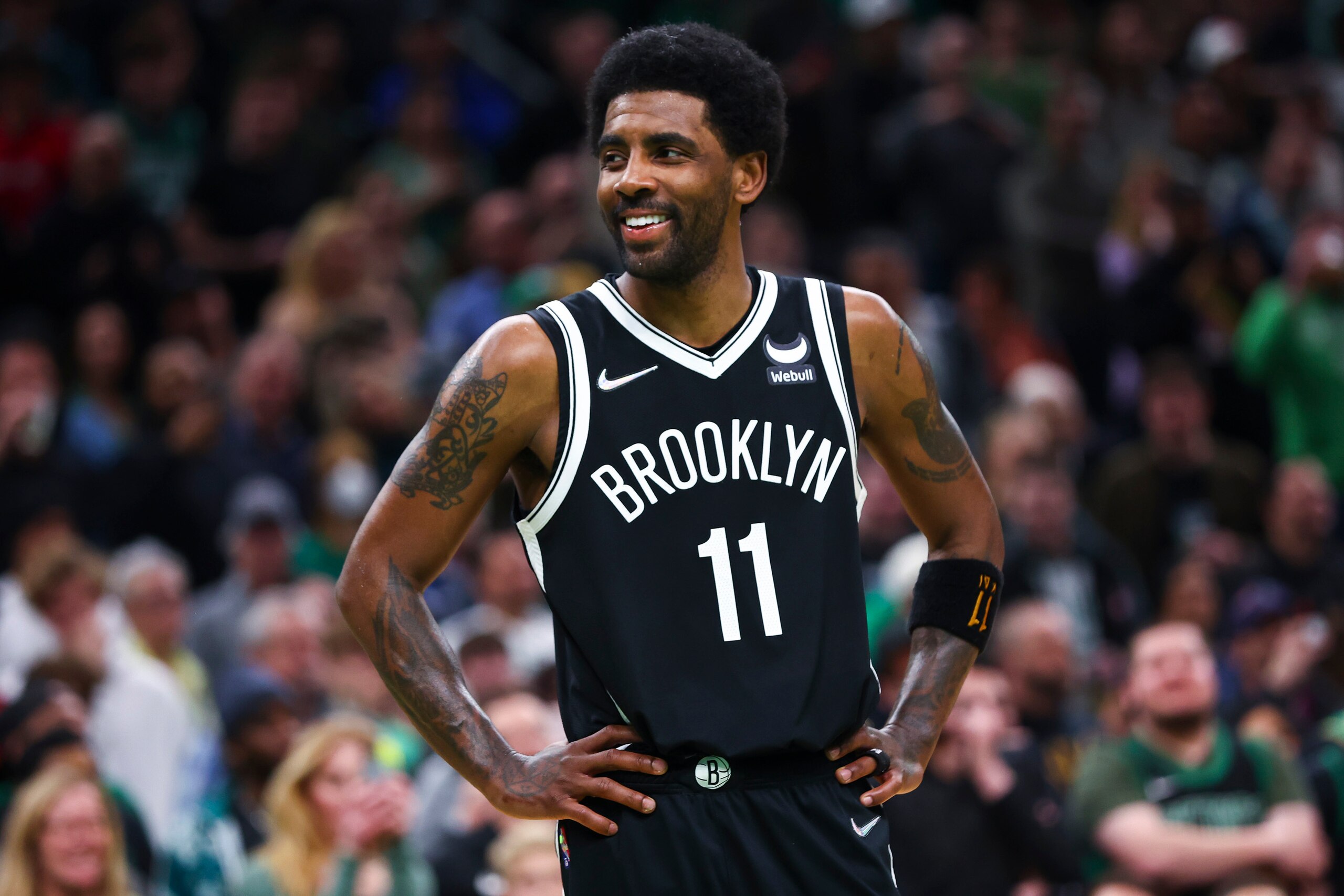 BOSTON, MA - MARCH 06:  Kyrie Irving #11 of the Brooklyn Nets smiles during a game against the Boston Celtics at TD Garden on March 6, 2022 in Boston, Massachusetts. NOTE TO USER: User expressly acknowledges and agrees that, by downloading and or using this photograph, User is consenting to the terms and conditions of the Getty Images License Agreement. (Photo by Adam Glanzman/Getty Images)