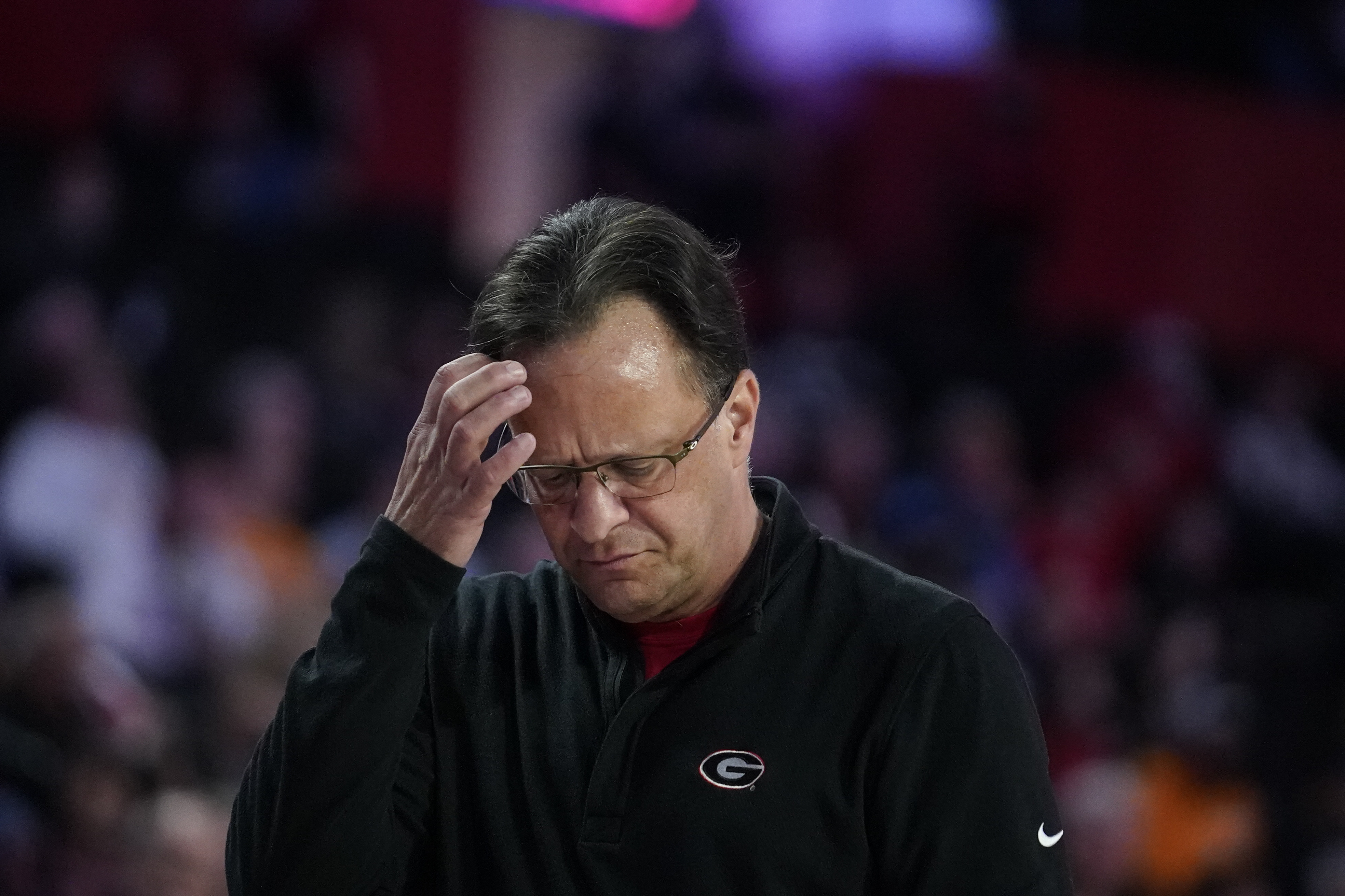 Georgia coach Tom Crean scratches his head during the first half of the team's NCAA college basketball game against Tennessee, Tuesday, March 1, 2022, in Athens, Ga. (AP Photo/Brynn Anderson)