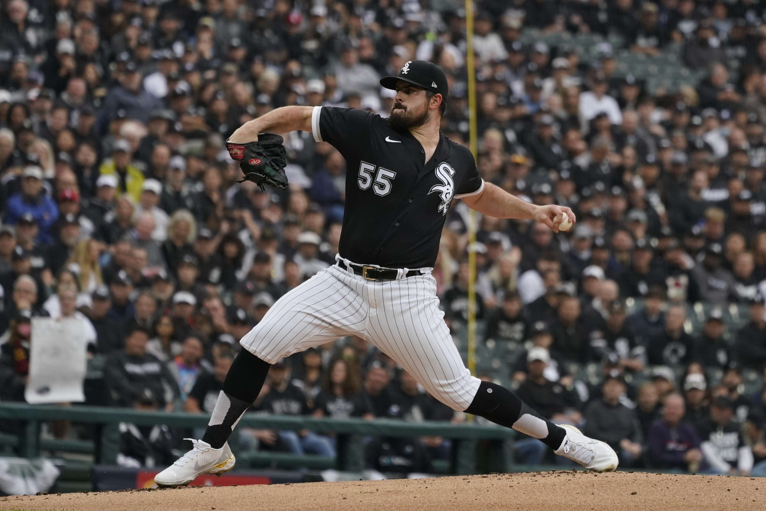Chicago White Sox pitcher Carlos Rodon throws against the Houston Astros in the inning during Game 4 of a baseball American League Division Series Tuesday, Oct. 12, 2021, in Chicago. (AP Photo/Nam Y. Huh)