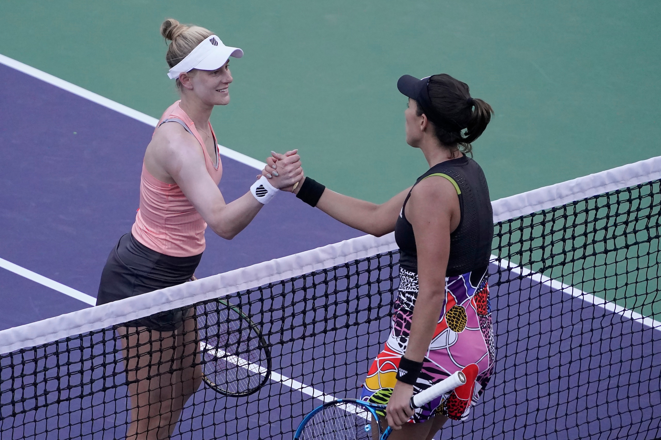 Alison Riske, left, shakes hands with Garbine Muguruza, of Spain, after Riske won their match at the BNP Paribas Open tennis tournament Friday, March 11, 2022, in Indian Wells, Calif. (AP Photo/Mark J. Terrill) Alison Riske, left, shakes hands with Garbine Muguruza, of Spain, after Riske won their match at the BNP Paribas Open tennis tournament Friday, March 11, 2022, in Indian Wells, Calif. (AP Photo/Mark J. Terrill)