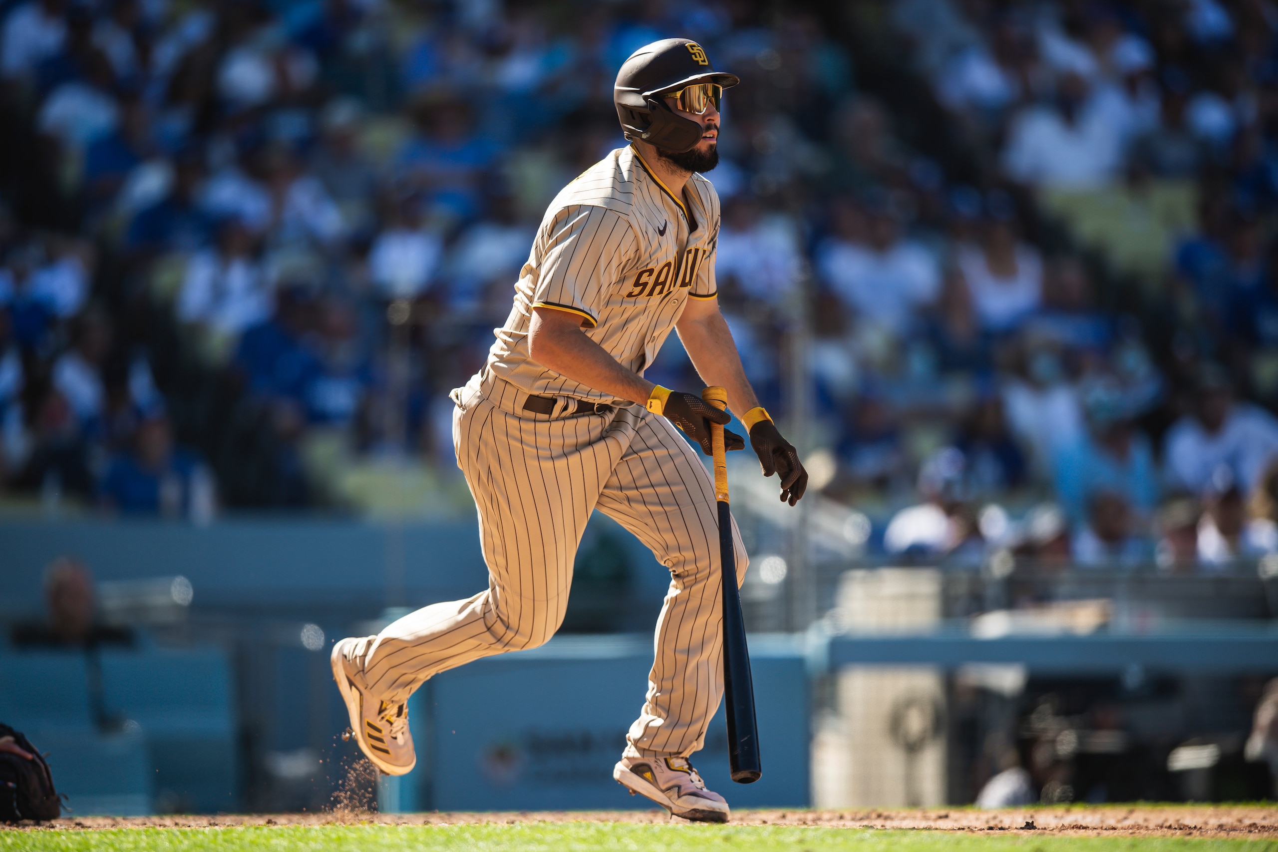 LOS ANGELES, CALIFORNIA - SEPTEMBER 12: Eric Hosmer #30 of the San Diego Padres hits a double in the eighth inning against the  Los Angeles Dodgers at Dodger Stadium on September 12, 2021 in Los Angeles, California. (Photo by Matt Thomas/San Diego Padres/Getty Images)