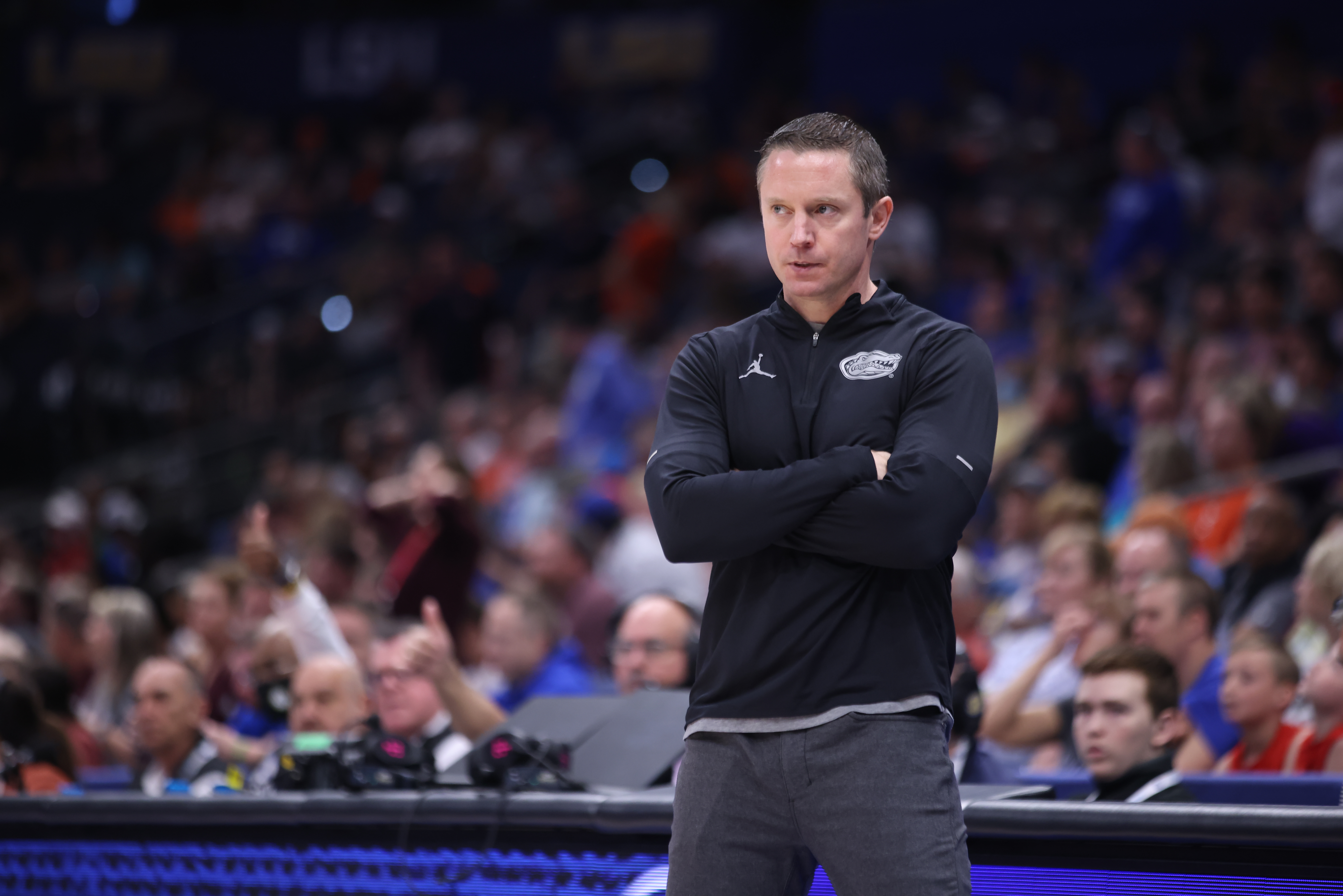 TAMPA, FL - MARCH 10: Florida Gators head coach Mike White watches the action during the SEC Tournament between the Florida Gators (#9) and the Texas A&M Aggies (#8) on Thursday, March 10, 2022 at the Amalie Arena in Tampa, FL (Photo by Peter Joneleit/Icon Sportswire via Getty Images)