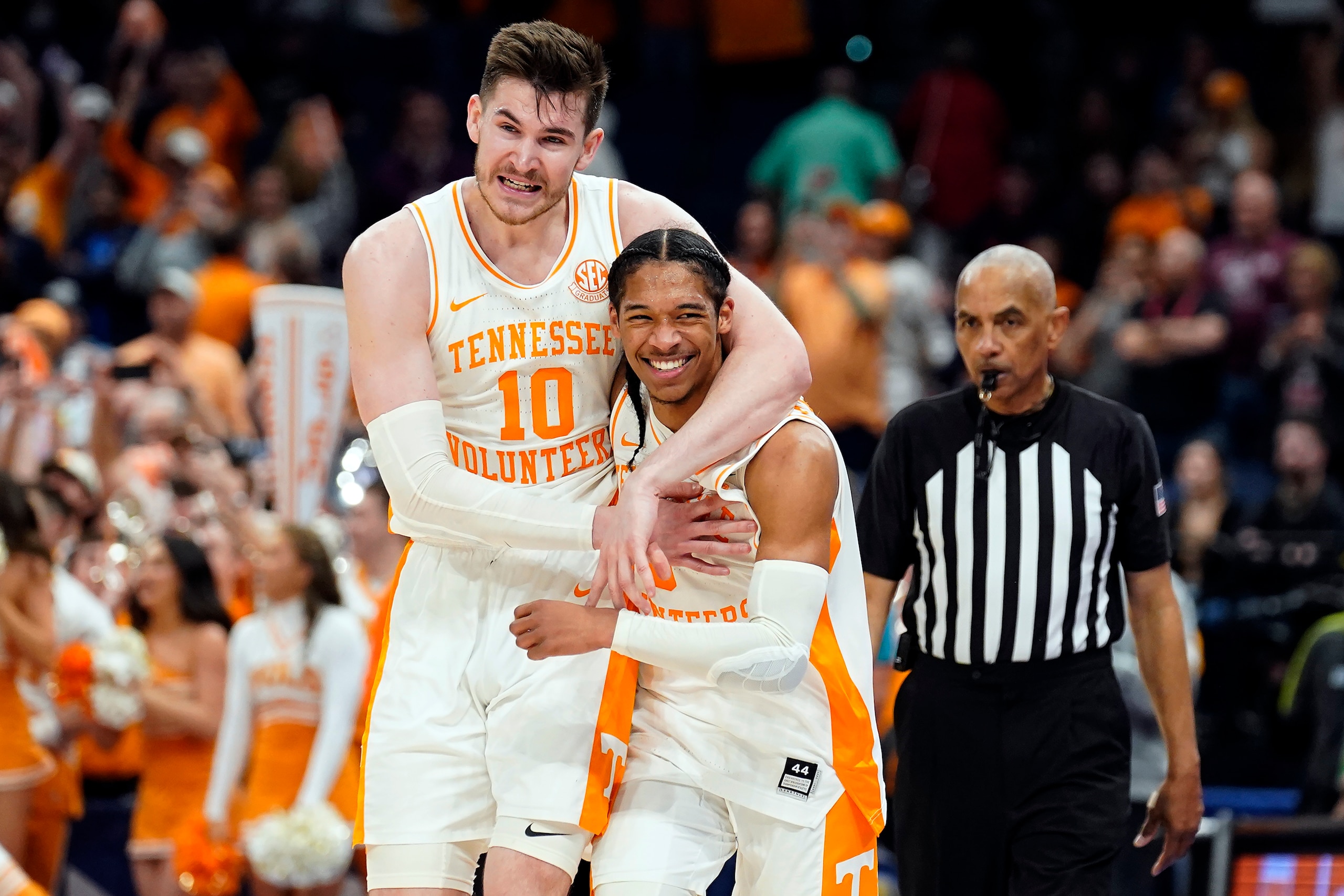 Tennessee forward John Fulkerson (10) celebrates with guard Zakai Zeigler (5) after the team defeated Texas A&M in an NCAA men's college basketball Southeastern Conference tournament championship game, Sunday, March 13, 2022, in Tampa, Fla. (AP Photo/Chris O'Meara)