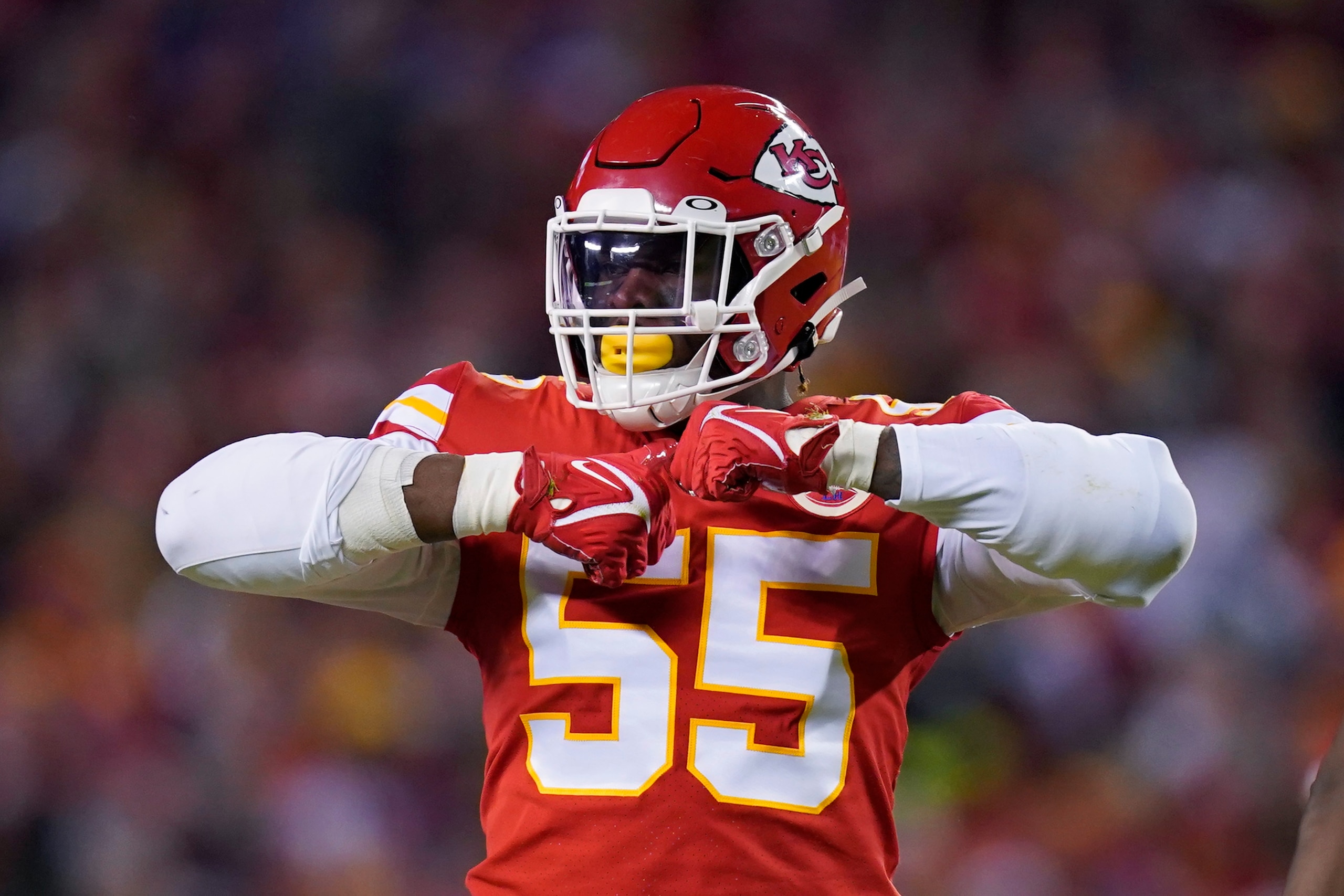 Kansas City Chiefs defensive end Frank Clark (55) celebrates after making a tackled during the first half of an NFL divisional round playoff football game against the Buffalo Bills, Sunday, Jan. 23, 2022, in Kansas City, Mo. (AP Photo/Ed Zurga)