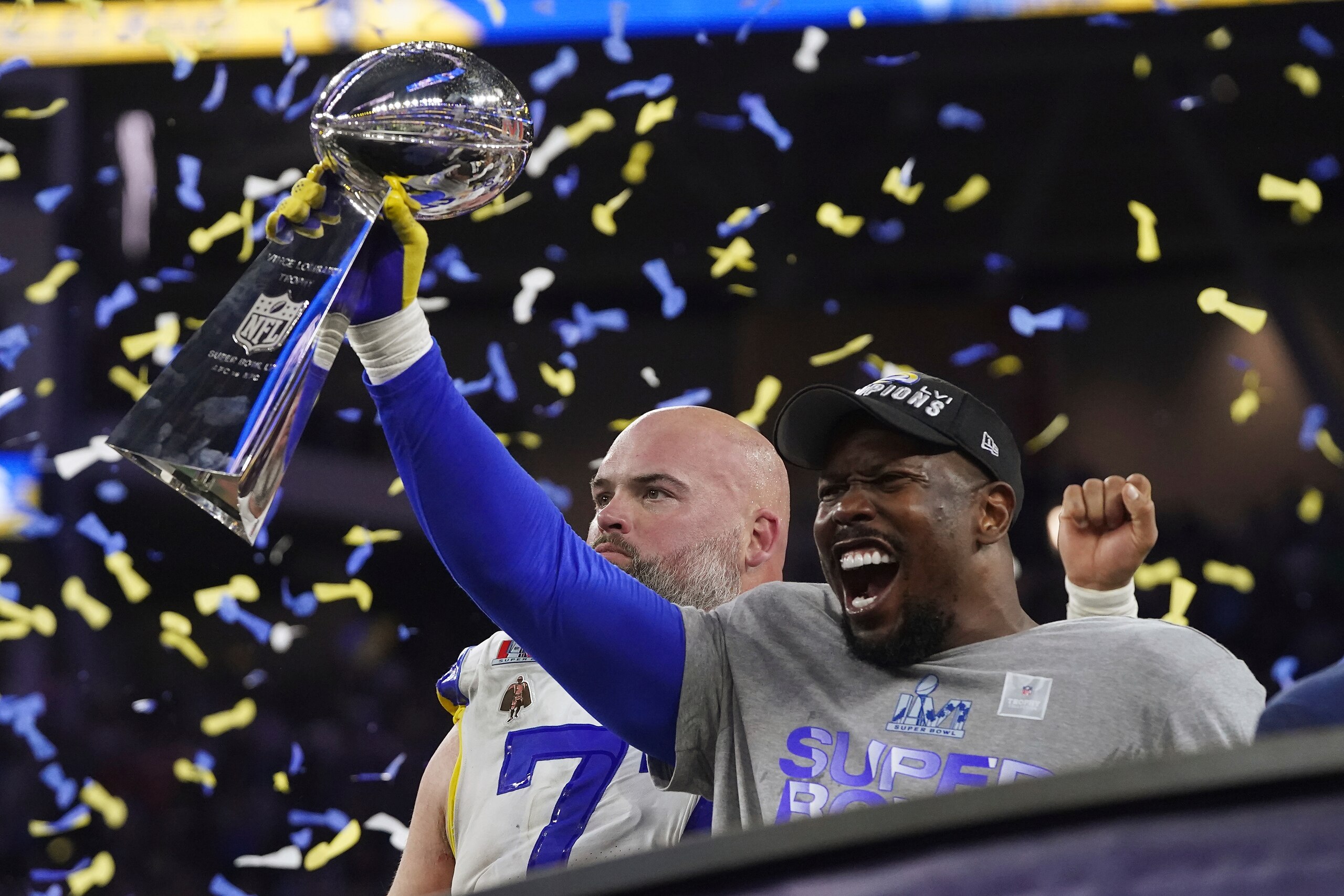 Los Angeles Rams linebacker Von Miller (40) holds up the Lombardi Trophy while celebrating victory over the Cincinnati Bengals in Super Bowl 56, Sunday, Feb. 13, 2022 in Inglewood, Calif. (AP Photo/Doug Benc)
