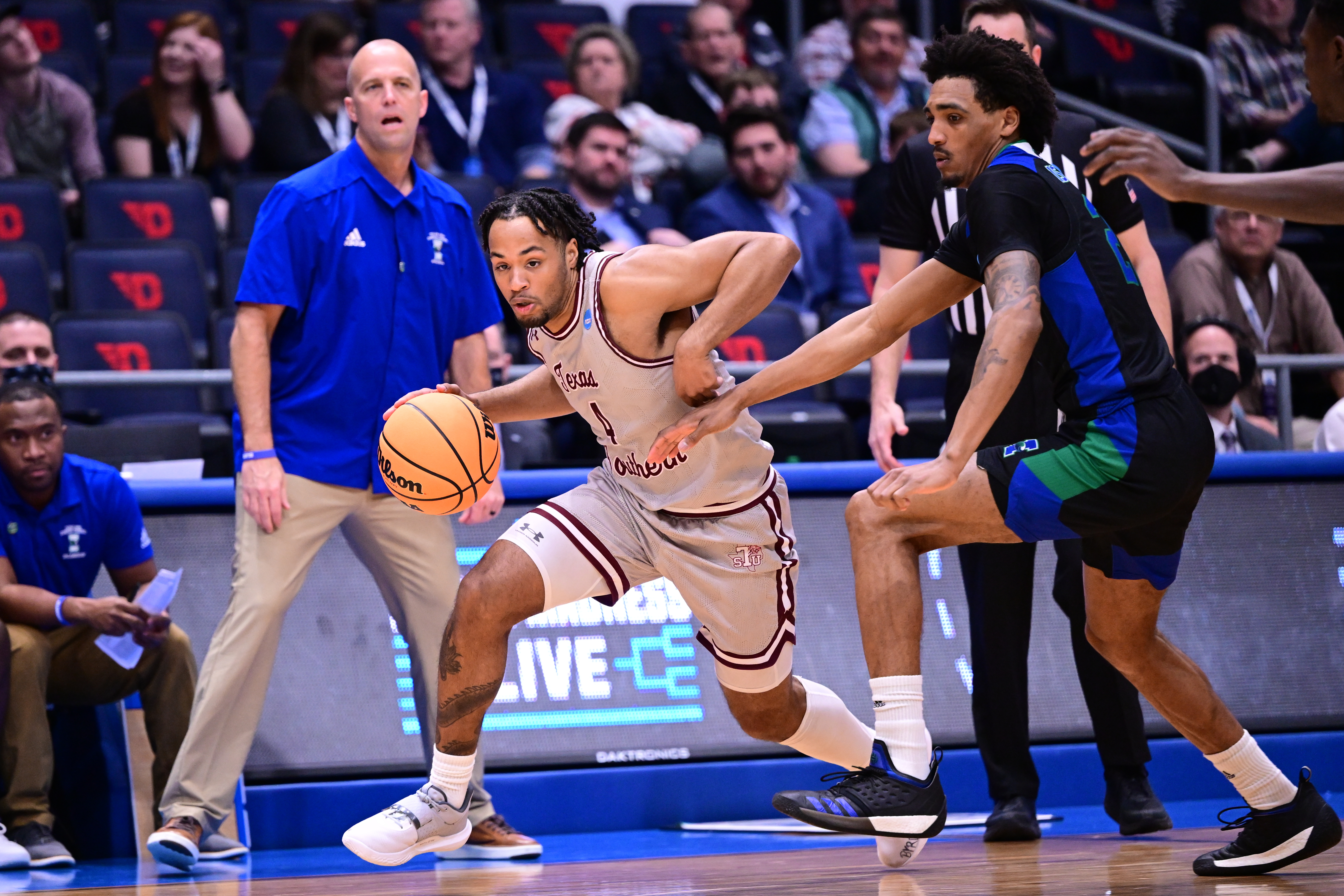 DAYTON, OH - MARCH 15: Bryson Etienne #4 of the Texas Southern Tigers tries to dribble past Simeon Fryer #22 of the Texas A&M Corpus Christi Islanders during the First Four round of the 2022 NCAA Men's Basketball Tournament held at UD Arena on March 15, 2022 in Dayton, Ohio. (Photo by Ben Solomon/NCAA Photos via Getty Images )