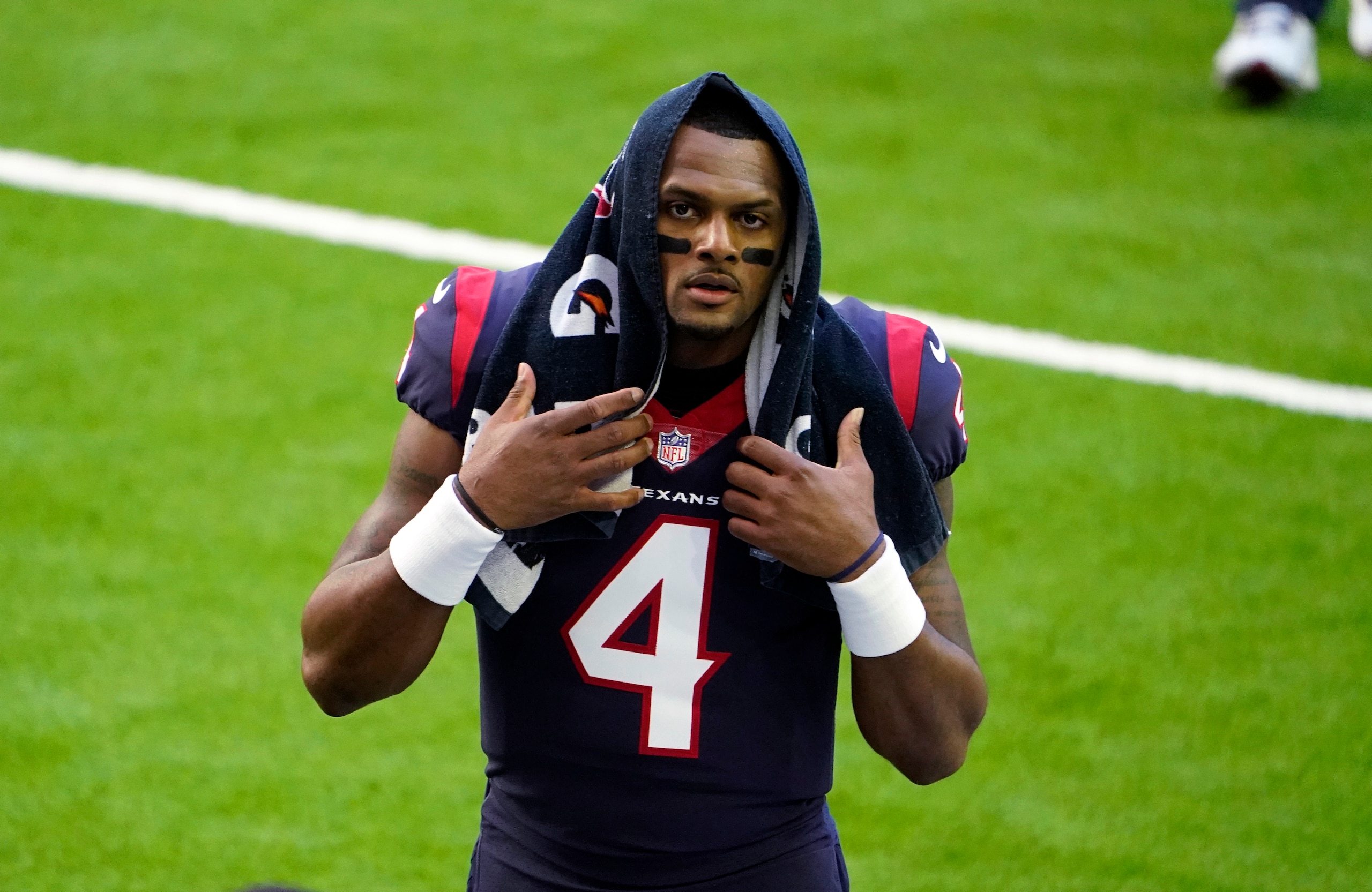 FILE - In this Jan. 3, 2021, file photo, Houston Texans quarterback Deshaun Watson walks off the field before the team's NFL football game against the Tennessee Titans in Houston. Watson, who is accused of sexual assault and harassment in lawsuits filed by 21 women, is being investigated by police after a report was filed regarding the NFL player, officials said Friday, April 2. In a tweet Friday, the Houston Police Department said a complainant had filed a report with the agency about Watson. (AP Photo/Eric Christian Smith, File)