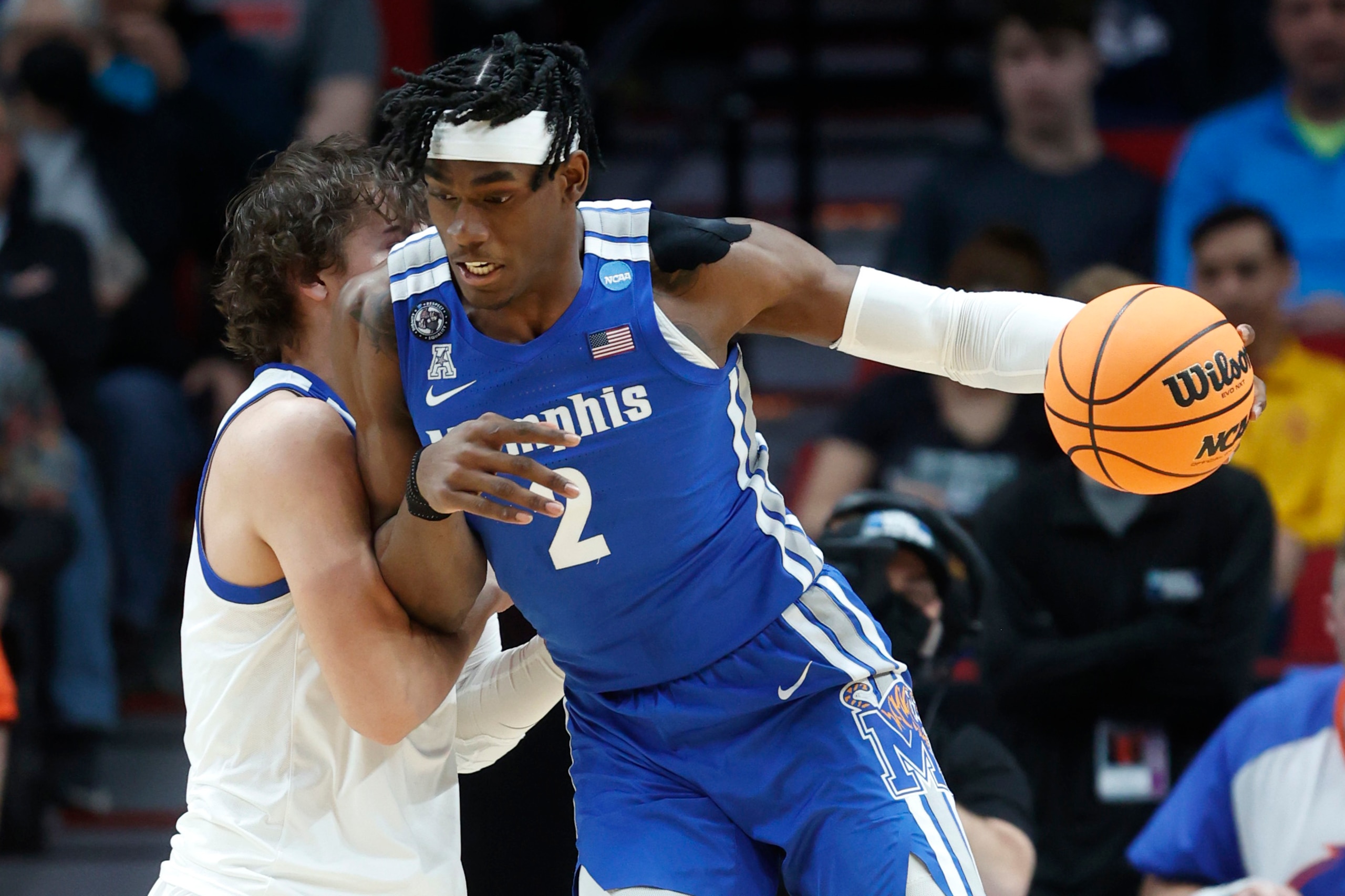 Memphis center Jalen Duren (2) drives past Boise State forward Tyson Degenhart, left, during the first half of a first round NCAA college basketball tournament game, Thursday, March 17, 2022, in Portland, Ore. (AP Photo/Craig Mitchelldyer)