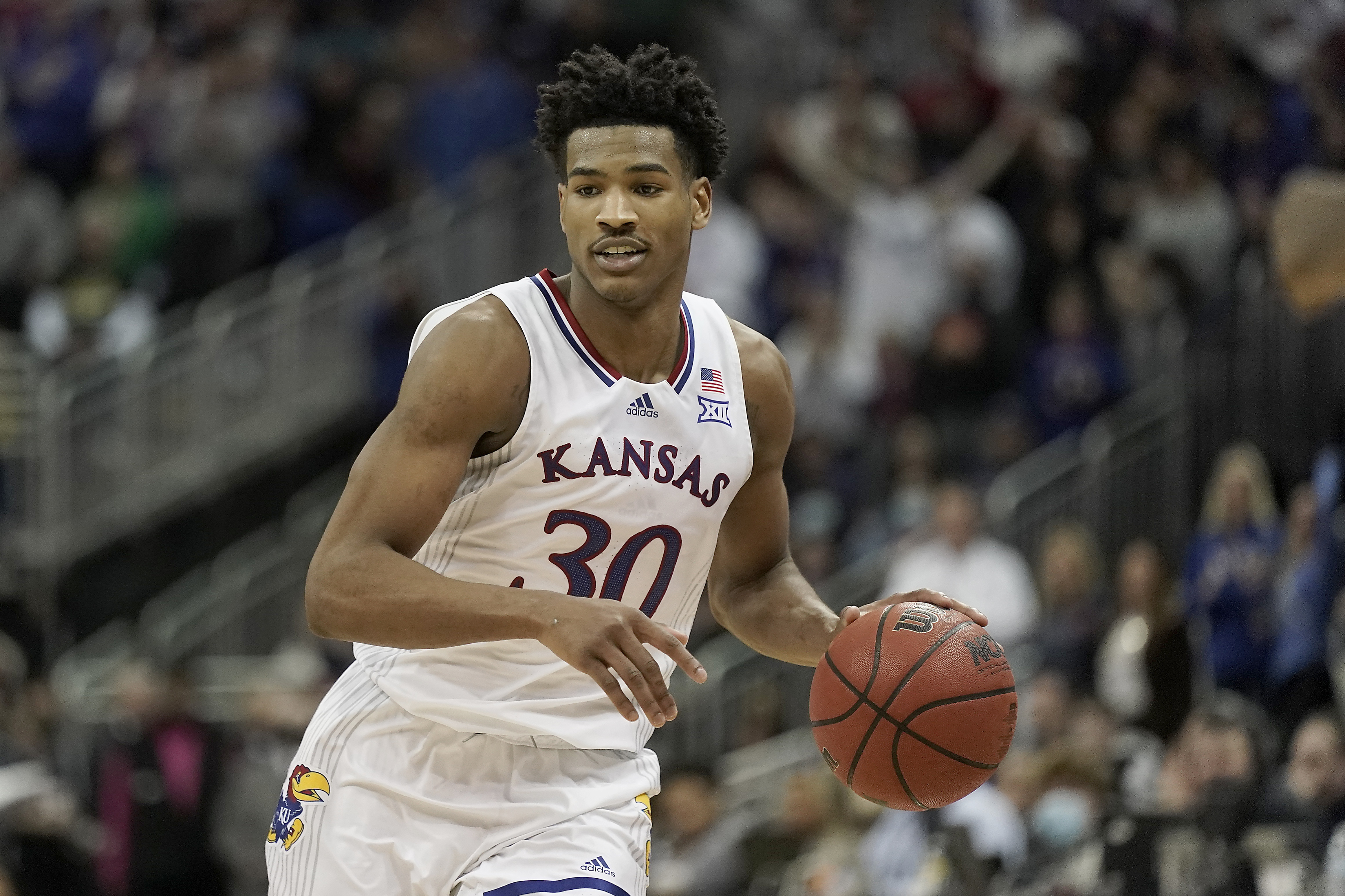 Kansas guard Ochai Agbaji drives during the second half of an NCAA college basketball championship game against Texas Tech in the Big 12 Conference tournament in Kansas City, Mo., Saturday, March 12, 2022. Kansas won 74-65. (AP Photo/Charlie Riedel)