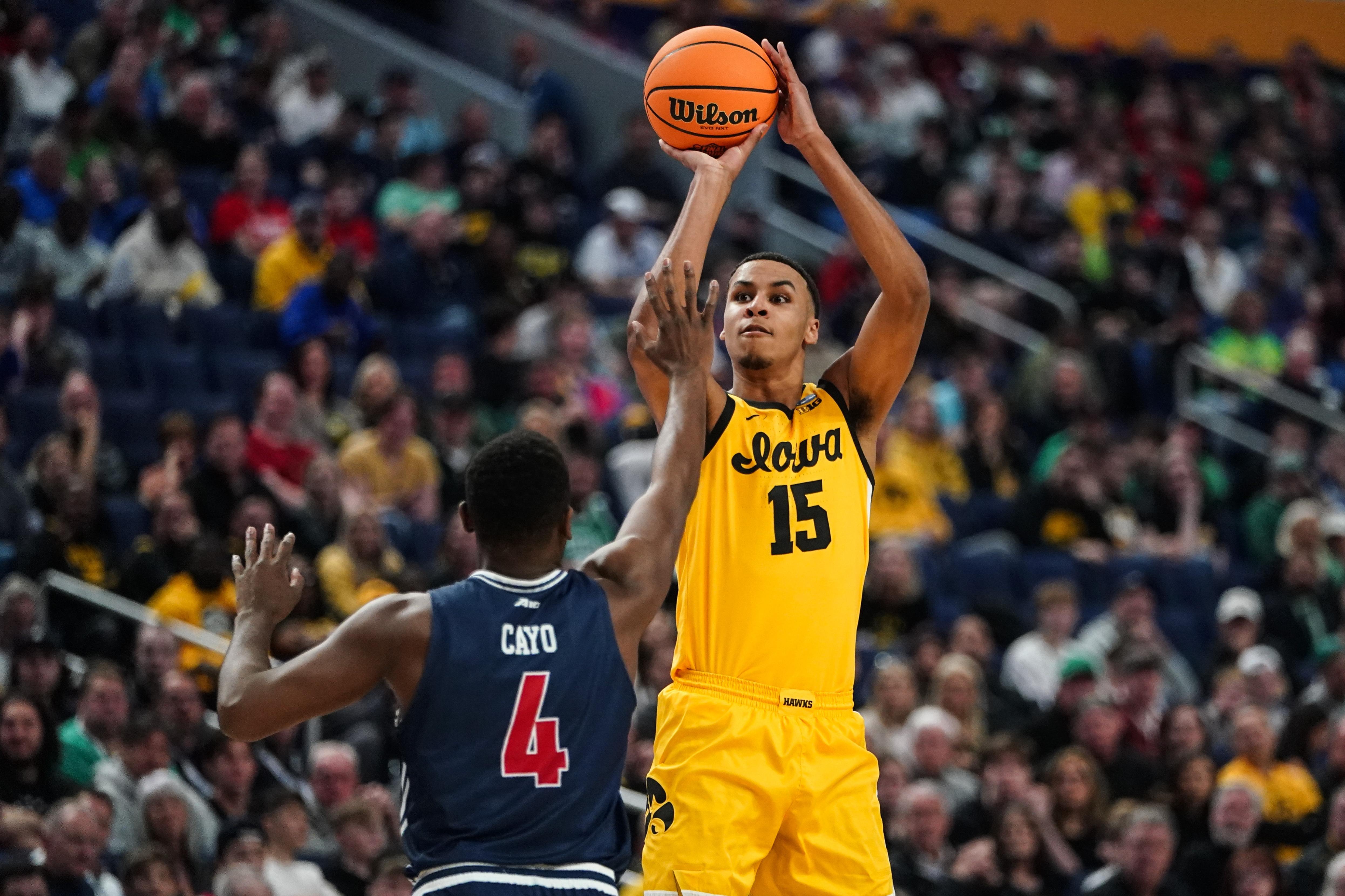 Iowa's Keegan Murray (15) shoots over Richmond's Nathan Cayo (4) in the first half of a college basketball game during the first round of the NCAA men's tournament Thursday, March 17, 2022, in Buffalo, N.Y. (AP Photo/Frank Franklin II)