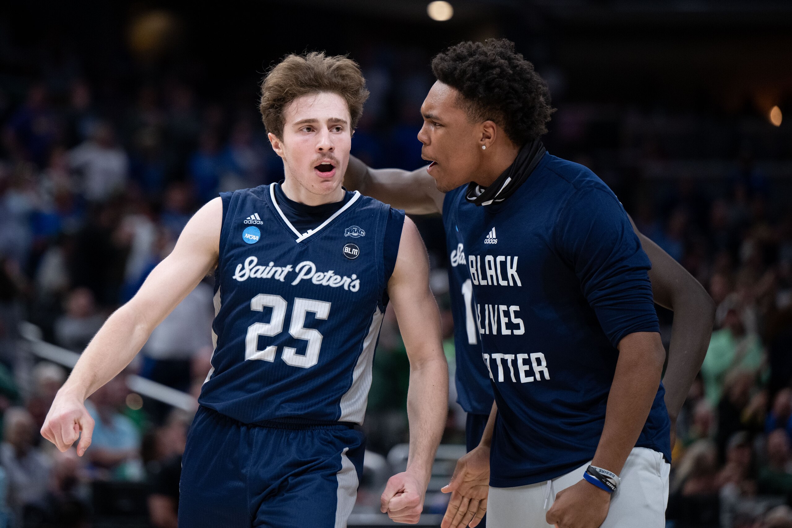 INDIANAPOLIS, IN - MARCH 17: Saint Peter's Peacocks guard Doug Edert (25) celebrates after a three pointer during the mens March Madness college basketball game between the Kentucky Wildcats and Saint Peters Peacocks on March 17, 2022, at Gainbridge Fieldhouse in Indianapolis, IN. (Photo by Zach Bolinger/Icon Sportswire via Getty Images)