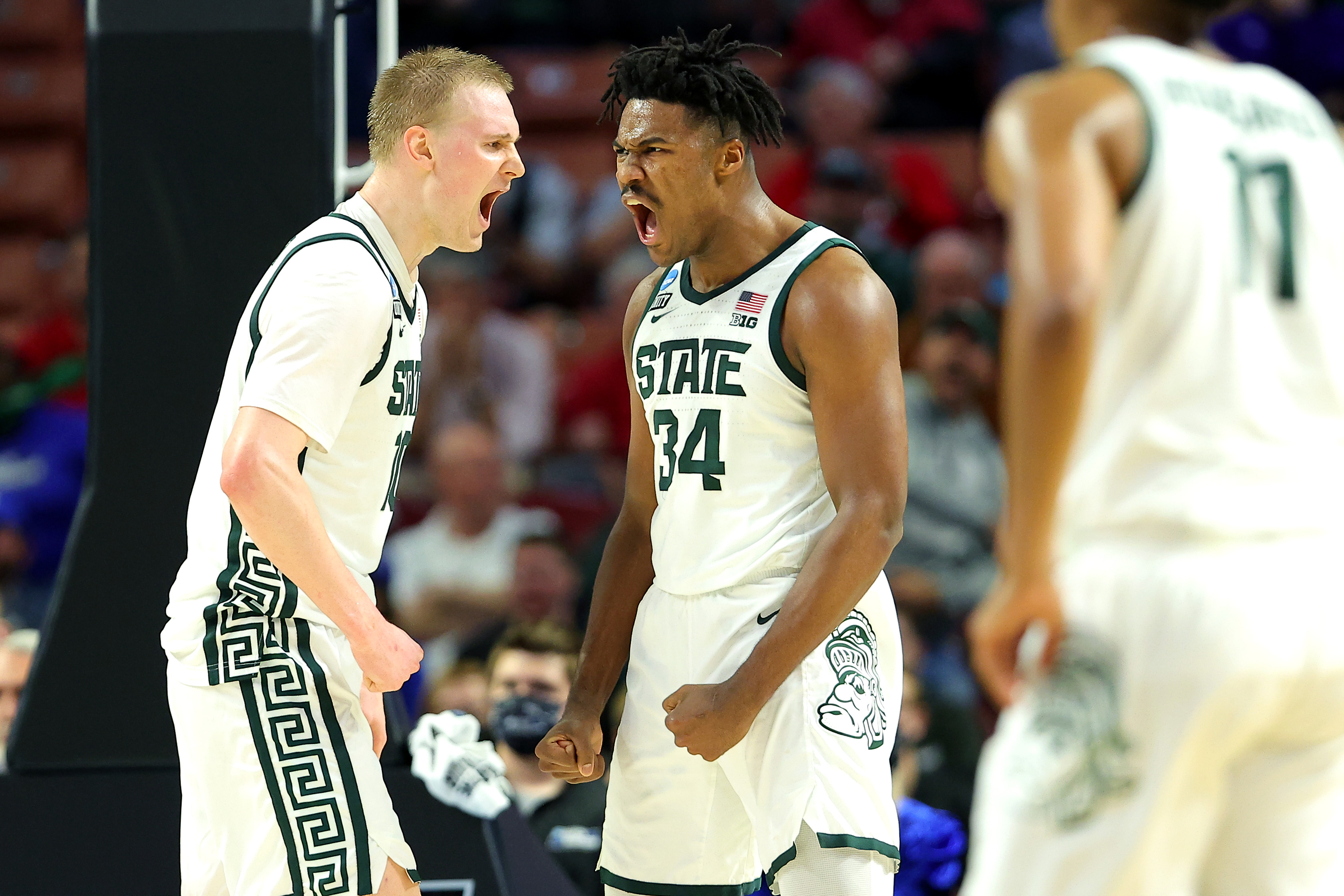 GREENVILLE, SOUTH CAROLINA - MARCH 18: Julius Marble II #34 and Joey Hauser #10 of the Michigan State Spartans react after a play against the Davidson Wildcats during the second half in the first round game of the 2022 NCAA Men's Basketball Tournament at Bon Secours Wellness Arena on March 18, 2022 in Greenville, South Carolina. (Photo by Kevin C. Cox/Getty Images)
