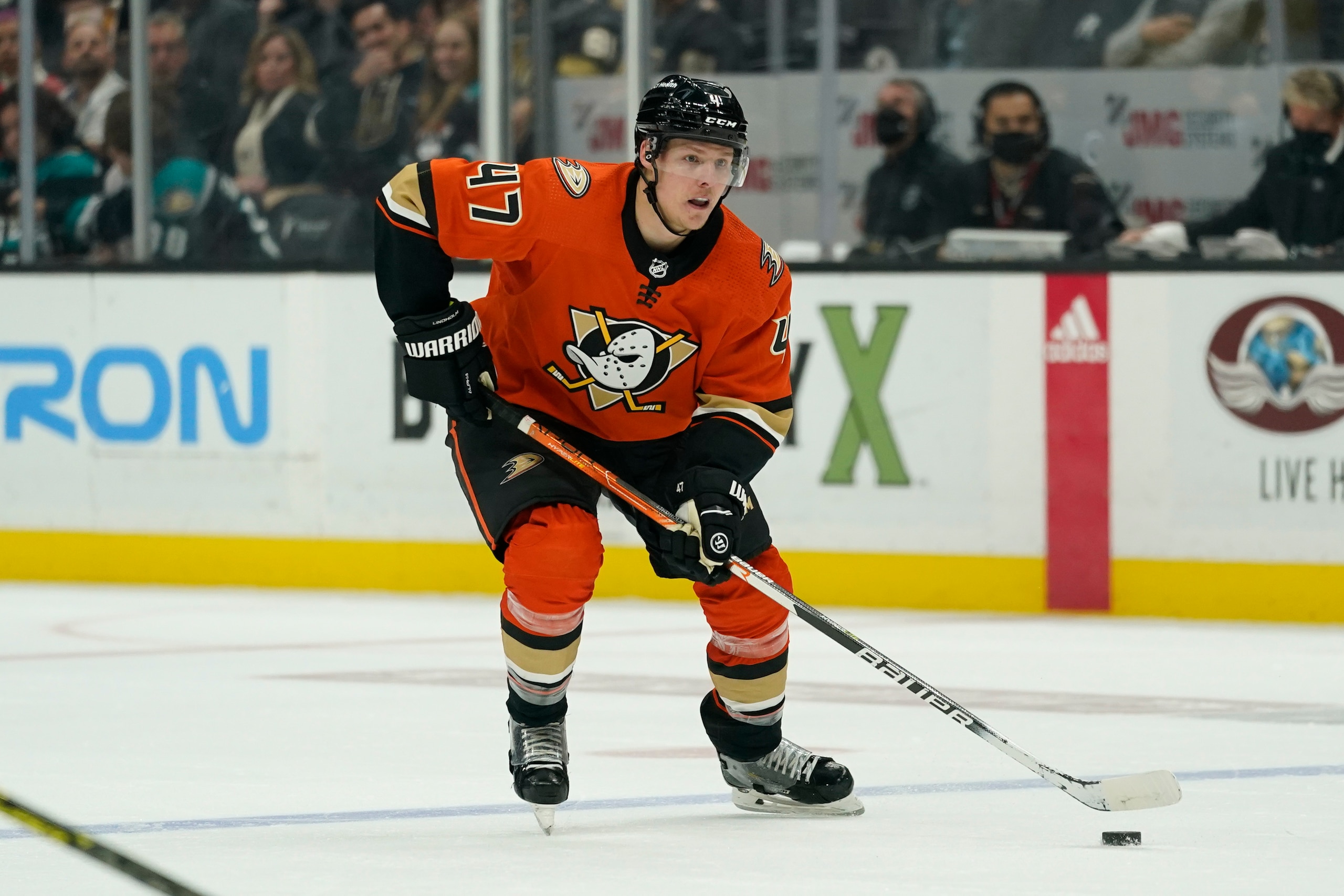 Anaheim Ducks defenseman Hampus Lindholm (47) controls the puck during the third period of an NHL hockey game against the Vegas Golden Knights in Anaheim, Calif., Friday, March 4, 2022. (AP Photo/Ashley Landis)