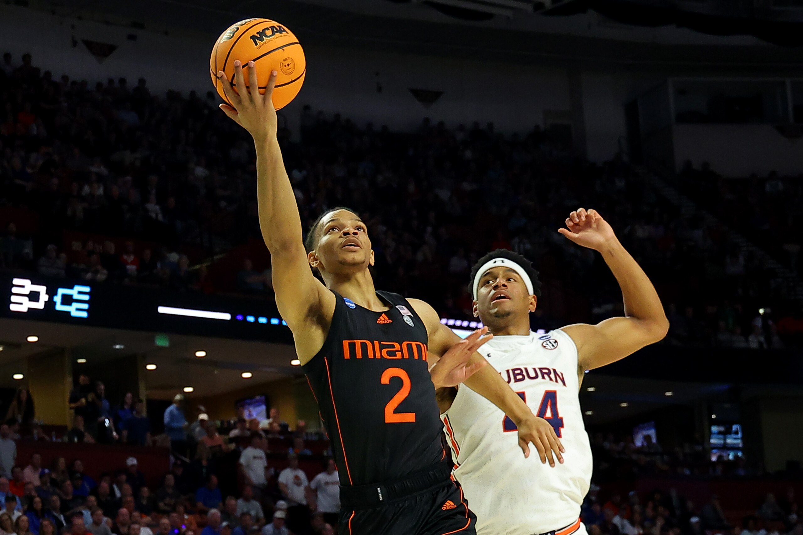 GREENVILLE, SOUTH CAROLINA - MARCH 20: Isaiah Wong #2 of the Miami (Fl) Hurricanes shoots past Dylan Cardwell #44 of the Auburn Tigers in the first half during the second round of the 2022 NCAA Men's Basketball Tournament at Bon Secours Wellness Arena on March 20, 2022 in Greenville, South Carolina. (Photo by Kevin C. Cox/Getty Images)