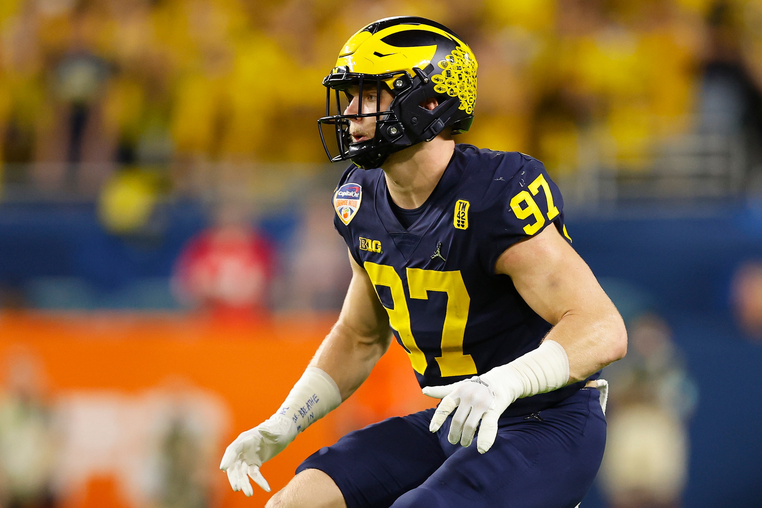 MIAMI GARDENS, FLORIDA - DECEMBER 31: Aidan Hutchinson #97 of the Michigan Wolverines in action against the Georgia Bulldogs during the first quarter in the Capital One Orange Bowl for the College Football Playoff semifinal game at Hard Rock Stadium on December 31, 2021 in Miami Gardens, Florida. (Photo by Michael Reaves/Getty Images)