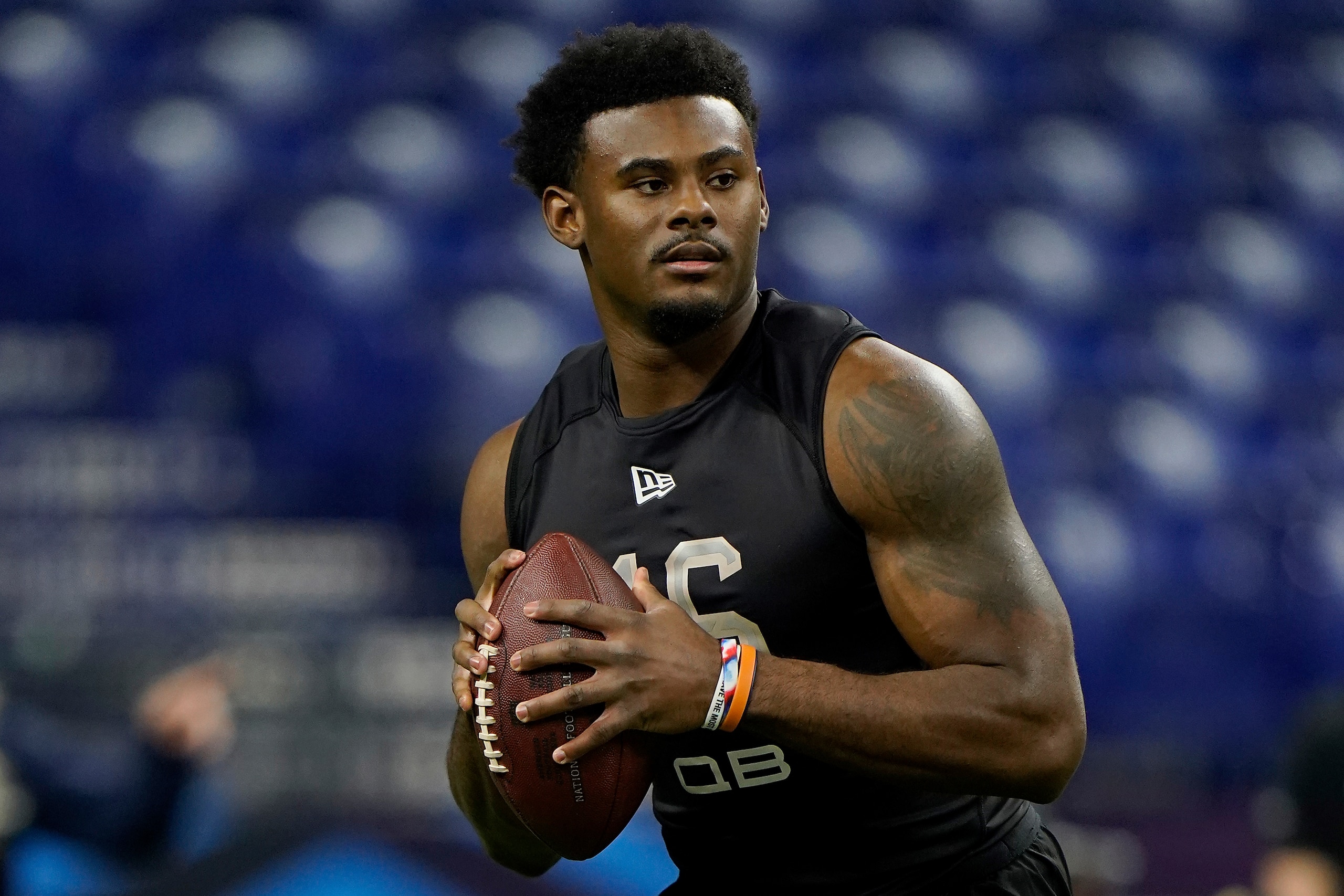 Liberty quarterback Malik Willis (16) prepares to throw the ball in a drill at the NFL football scouting combine in Indianapolis, Thursday, March 3, 2022. (AP Photo/Steve Luciano)