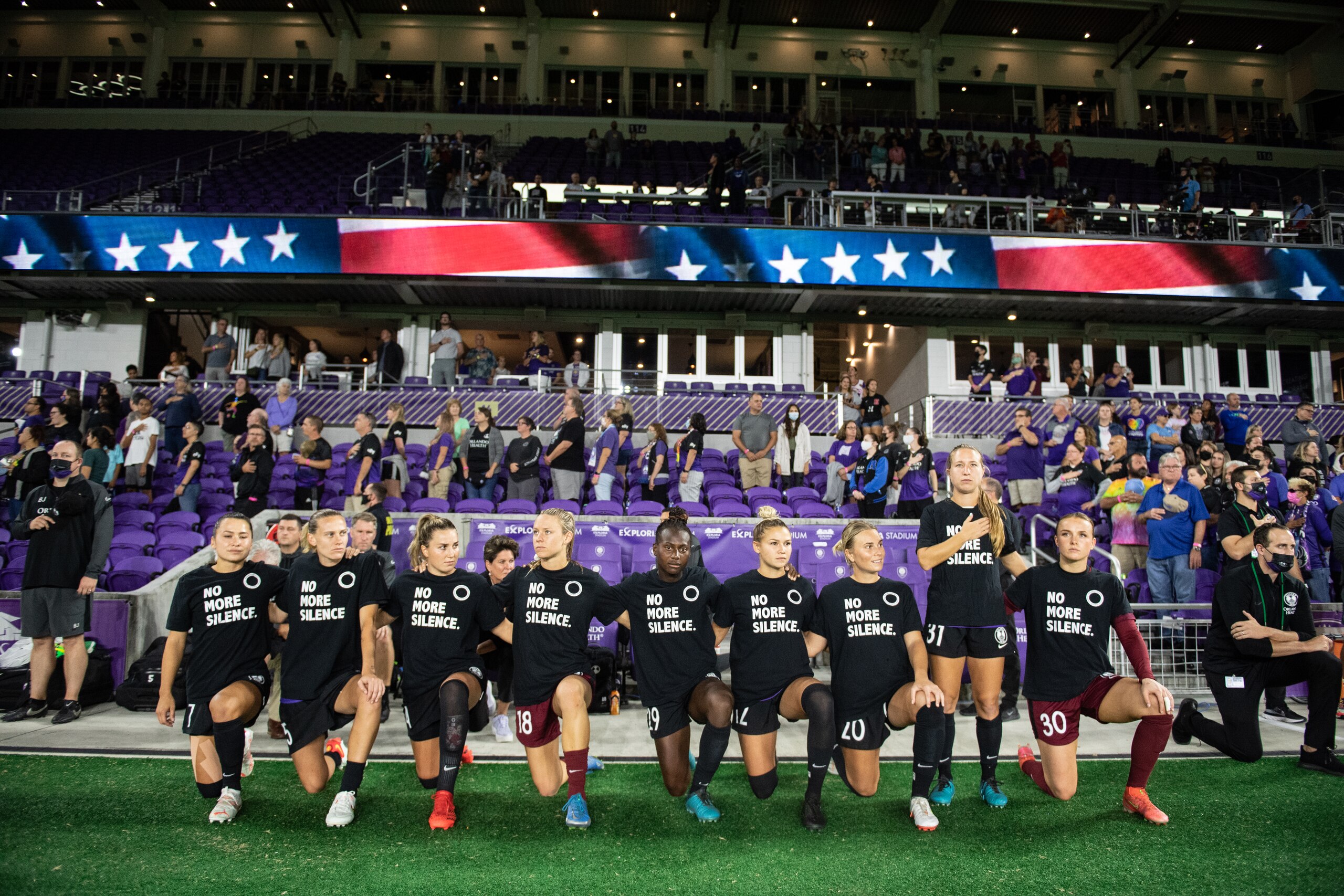 ORLANDO, FL - OCTOBER 29: Orlando Pride players kneeling for the anthem before a game between Chicago Red Stars and Orlando Pride at Exploria Stadium on October 29, 2021 in Orlando, Florida. (Photo by Jeremy Reper/ISI Photos/Getty Images)