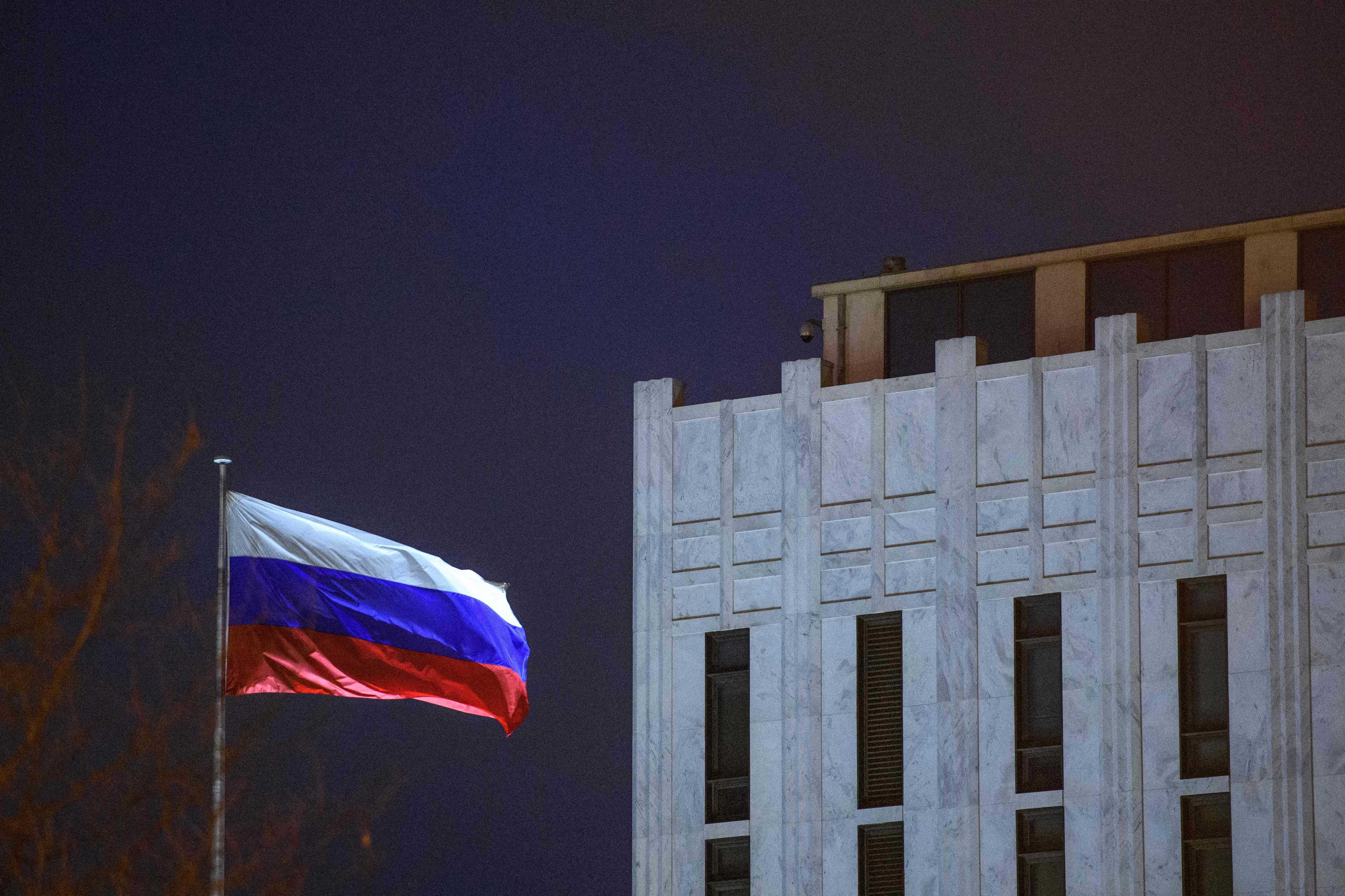 The Russian flag flies at the Embassy in Washington, DC, on March 3, 2022. (Photo by MANDEL NGAN / AFP) (Photo by MANDEL NGAN/AFP via Getty Images)