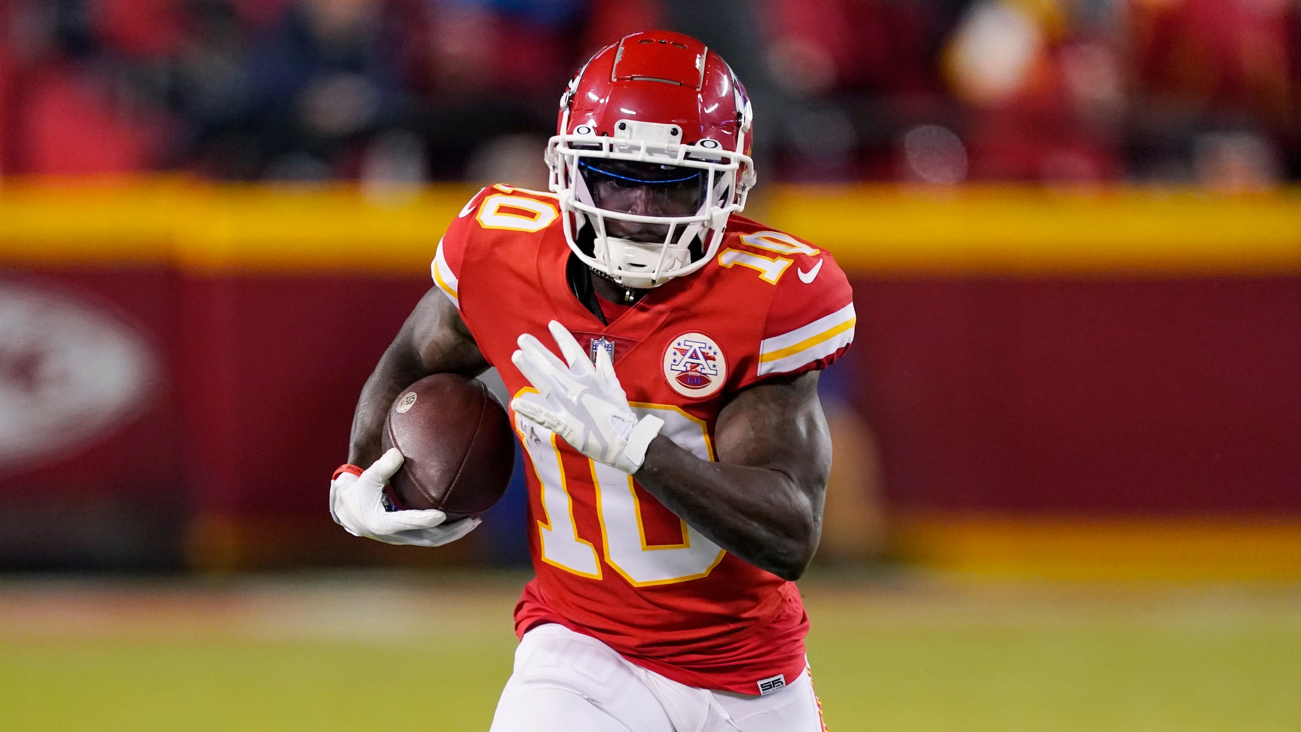 Kansas City Chiefs wide receiver Tyreek Hill (10) runs up field during the first half of an NFL divisional round playoff football game against the Buffalo Bills, Sunday, Jan. 23, 2022, in Kansas City, Mo. (AP Photo/Charlie Riedel)