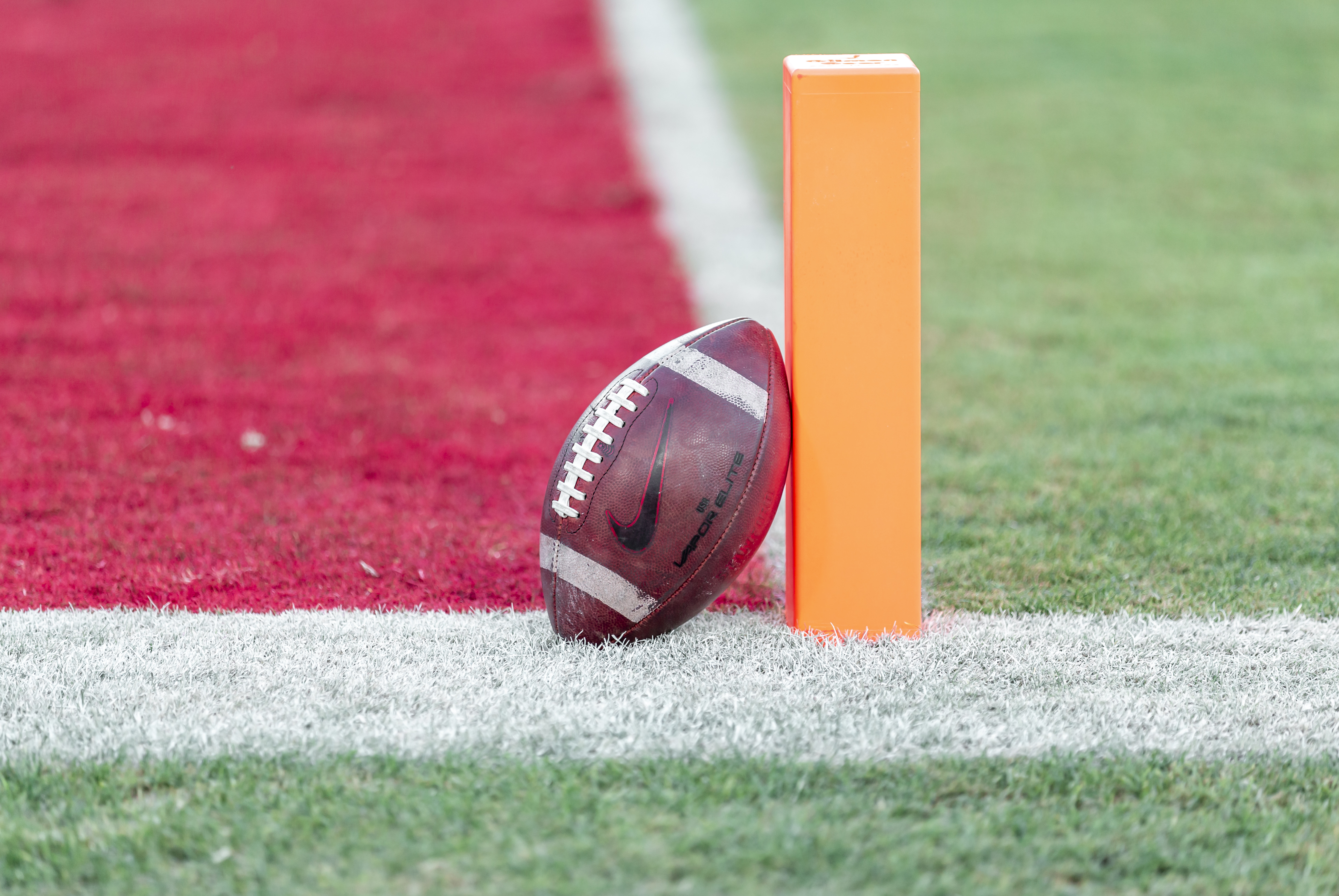 PALO ALTO, CA - NOVEMBER 27:  A close up view of an American football leaning on the goal line marker on the field at Stanford Stadium before an NCAA football game between the Notre Dame Fighting Irish and the Stanford Cardinal on November 27, 2021 in Palo Alto, California.  (Photo by David Madison/Getty Images)
