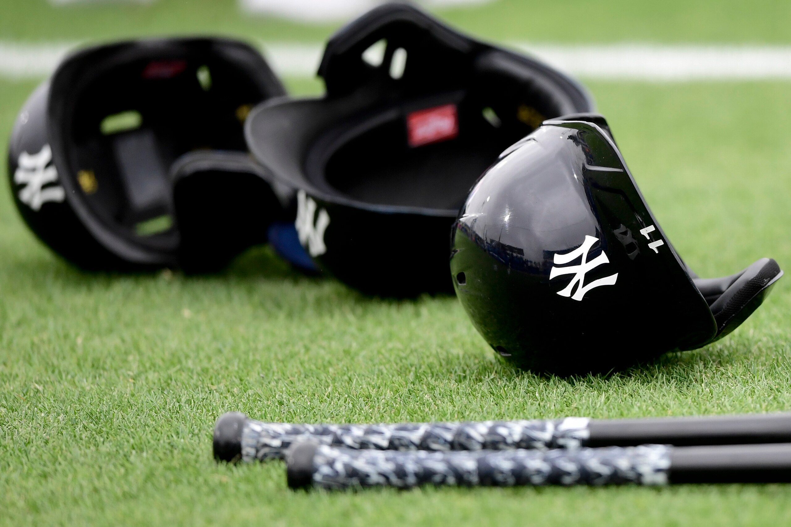 DUNEDIN, FLORIDA - MARCH 21: General view of the glove and hat of bats and helmets of the New York Yankees prior to the game between the Toronto Blue Jays and the Detroit Tigers during a spring training game at TD Ballpark on March 21, 2021 in Dunedin, Florida. (Photo by Douglas P. DeFelice/Getty Images)