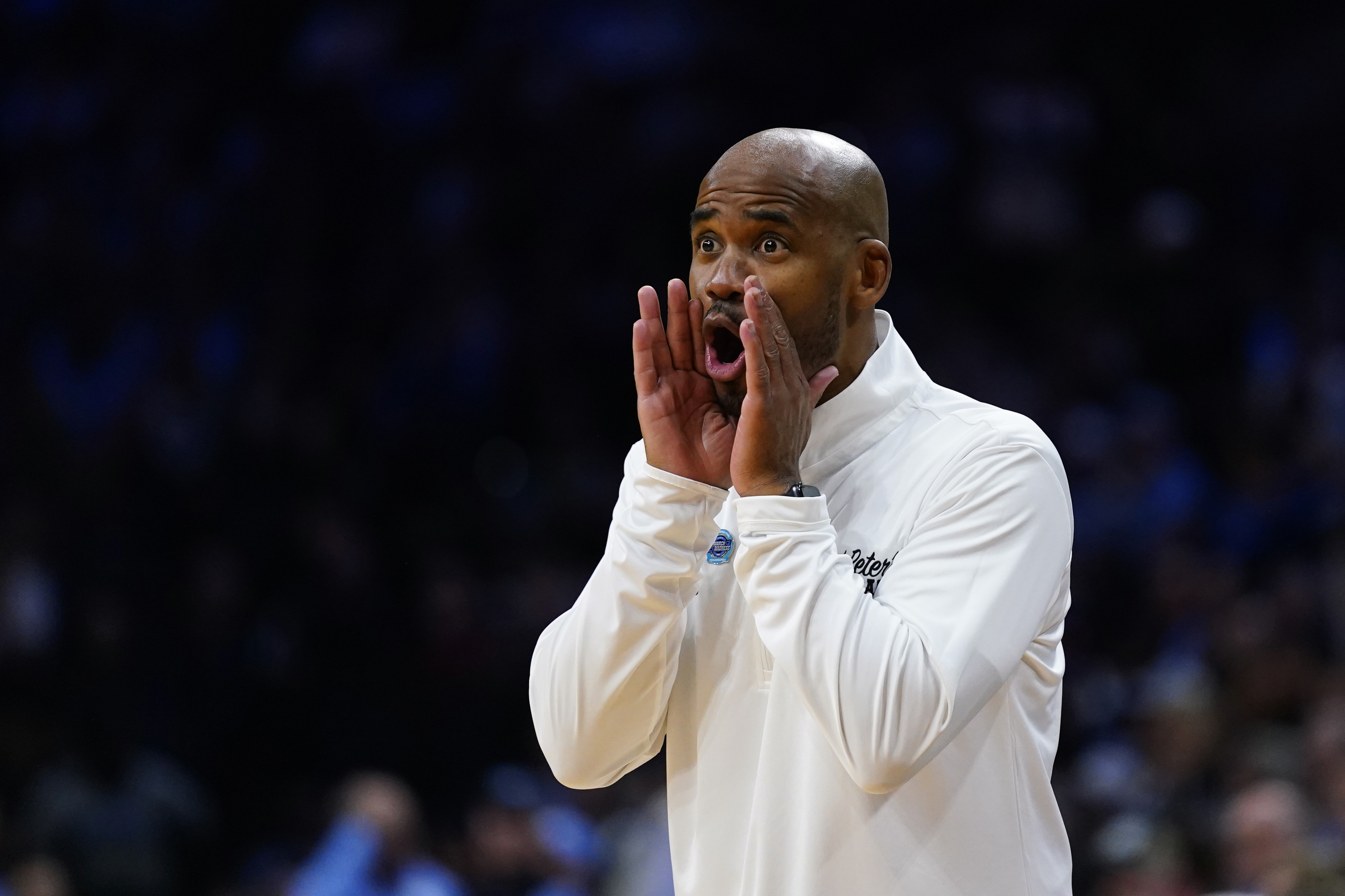 St. Peter's head coach Shaheen Holloway reacts during the first half of a college basketball game against North Carolina in the Elite 8 round of the NCAA tournament, Sunday, March 27, 2022, in Philadelphia. (AP Photo/Chris Szagola)