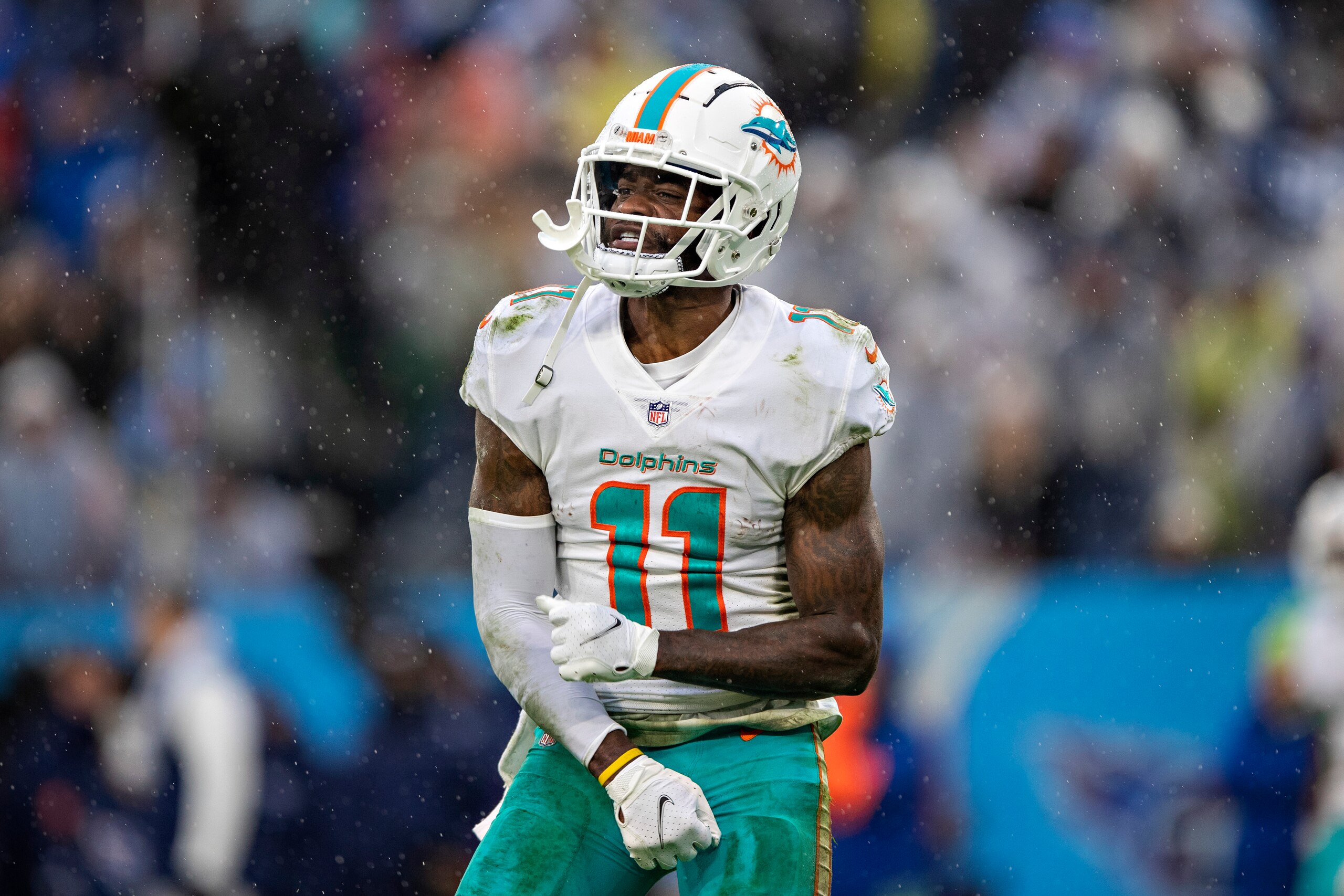 NASHVILLE, TENNESSEE - JANUARY 2:  DeVante Parker #11 of the Miami Dolphins celebrates after a big play during a game against the Tennessee Titans at Nissan Stadium on January 2, 2022 in Nashville, Tennessee.  The Titans defeated the Dolphins 34-3.  (Photo by Wesley Hitt/Getty Images)