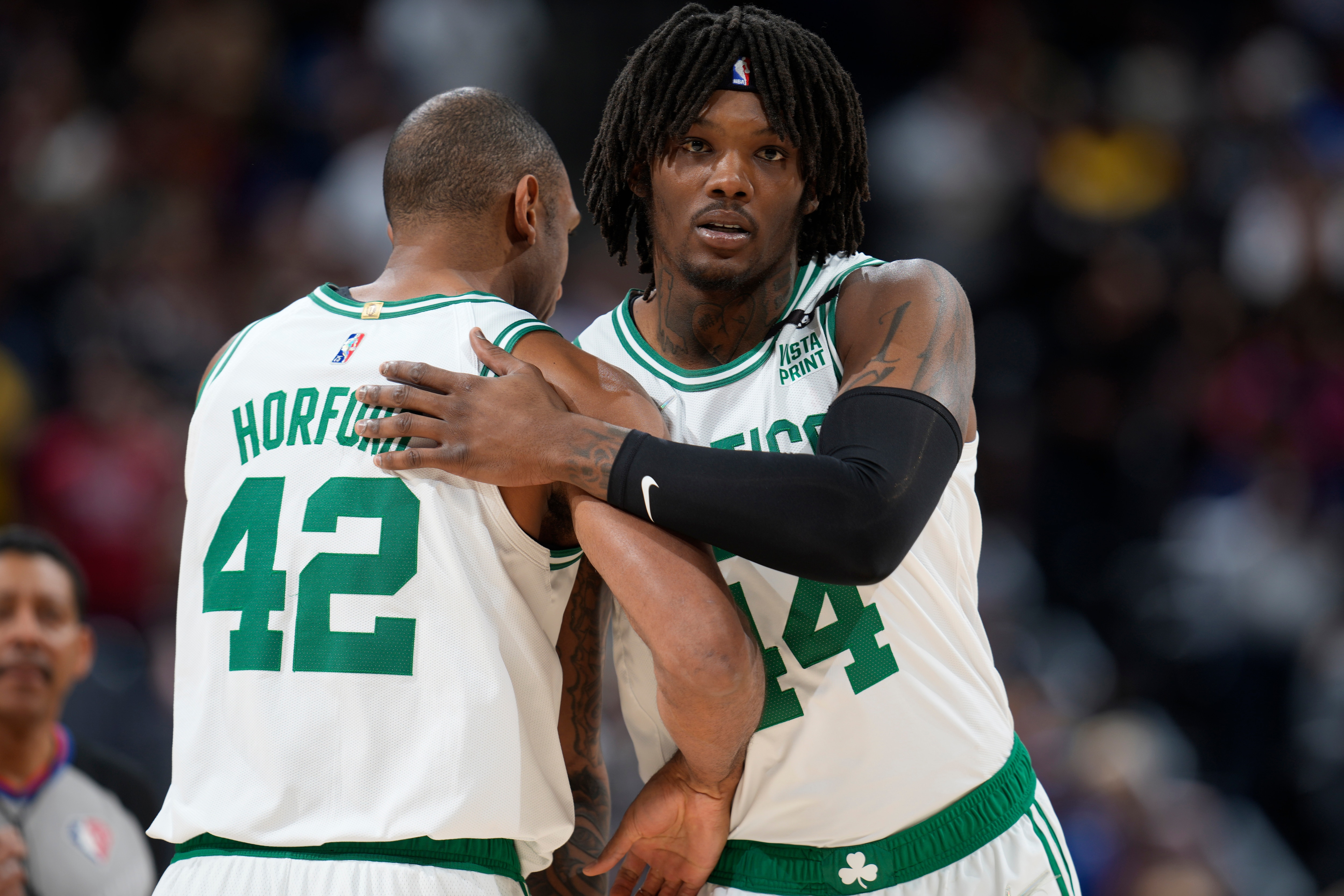 Boston Celtics center Al Horford (42) an Boston Celtics center Robert Williams III (44) in the first half of an NBA basketball game Sunday, March 20, 2022, in Denver. (AP Photo/David Zalubowski)