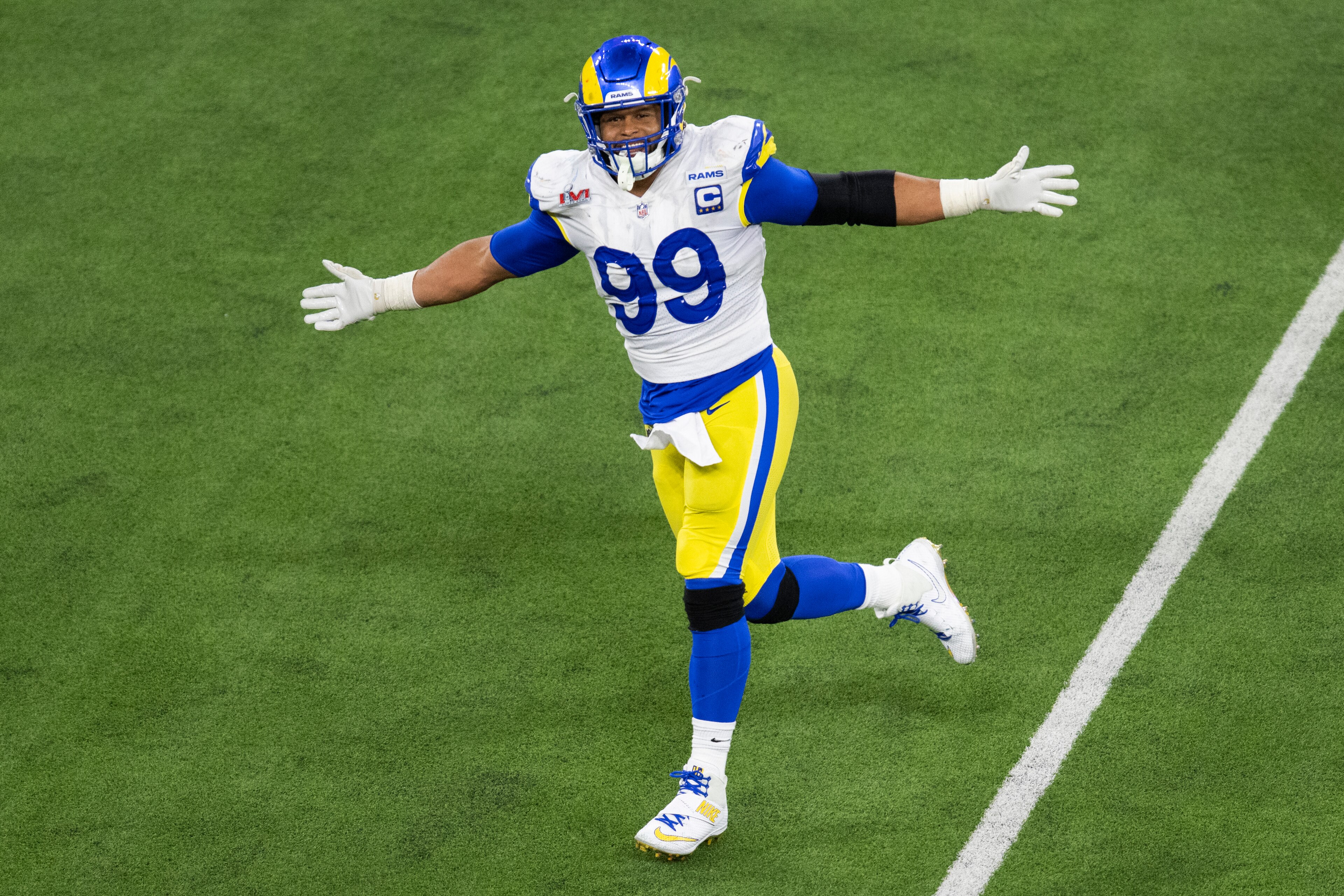 Los Angeles Rams defensive end Aaron Donald (99) reacts after forcing Cincinnati Bengals quarterback Joe Burrow (9) to throw an incomplete pass during the second half of the NFL Super Bowl 56 football game Sunday, Feb. 13, 2022, in Inglewood, Calif. (AP Photo/Kyusung Gong) Los Angeles Rams defensive end Aaron Donald (99) reacts after forcing Cincinnati Bengals quarterback Joe Burrow (9) to throw an incomplete pass during the second half of the NFL Super Bowl 56 football game Sunday, Feb. 13, 2022, in Inglewood, Calif. (AP Photo/Kyusung Gong)