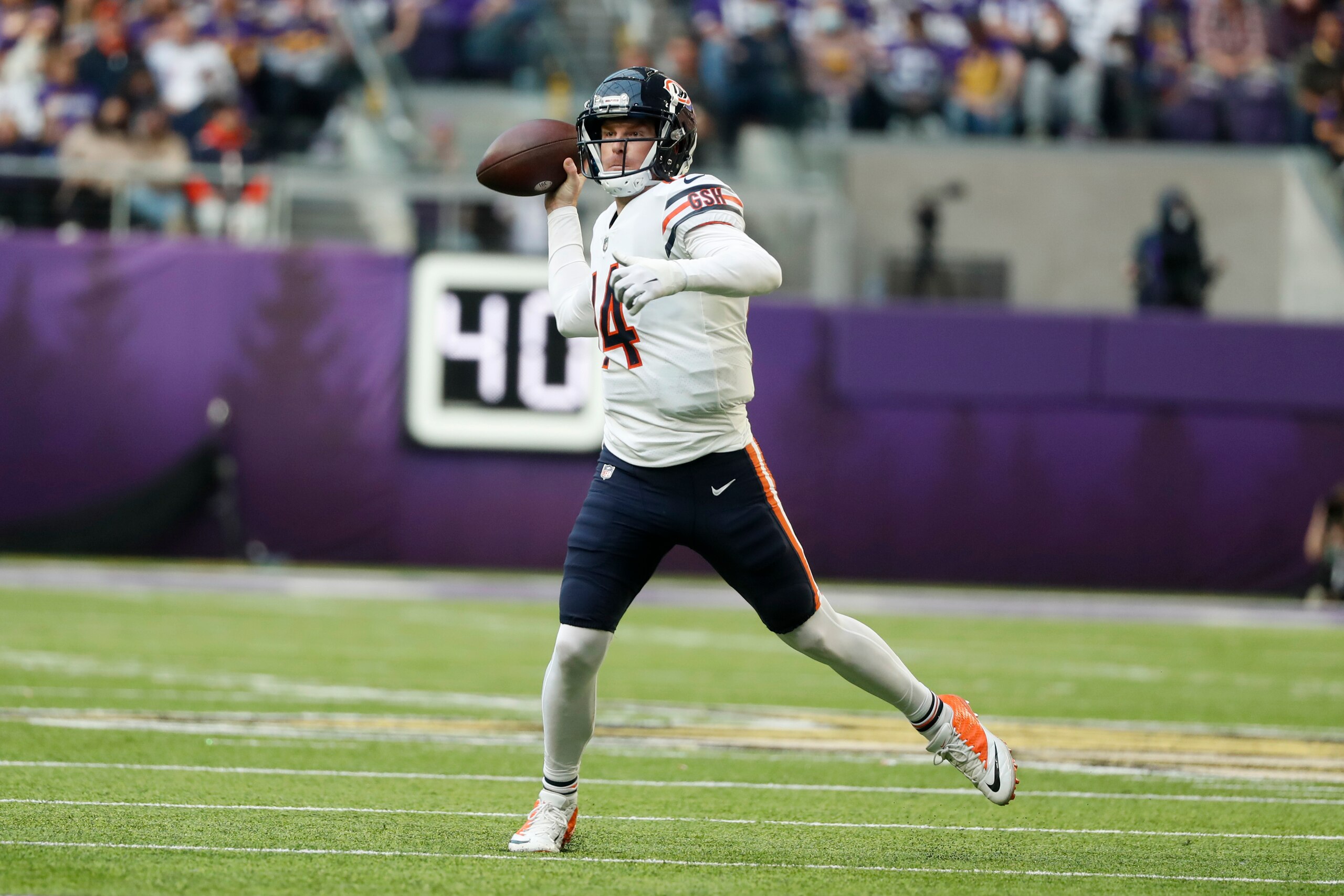 Chicago Bears quarterback Andy Dalton (14) looks to pass during the first half of an NFL football game against the Minnesota Vikings, Sunday, Jan. 9, 2022, in Minneapolis. (AP Photo/Bruce Kluckhohn)