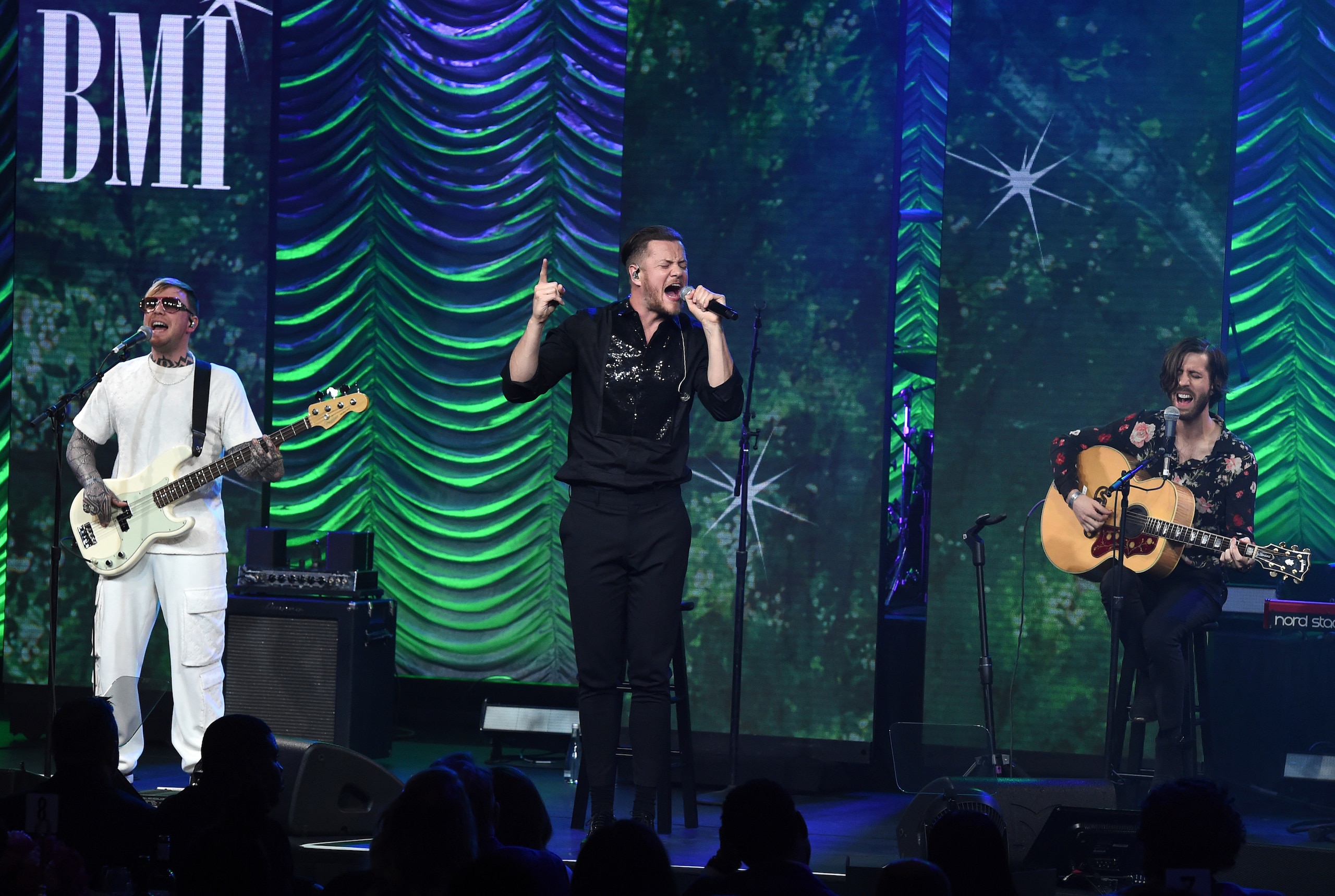 Ben McKee, from left, Dan Reynolds and Wayne Sermon, of Imagine Dragons, winners of the President's award, perform at the 67th annual BMI Pop Awards on Tuesday, May 14, 2019, at the Beverly Wilshire Hotel in Beverly Hills, Calif. (Photo by Chris Pizzello/Invision/AP)