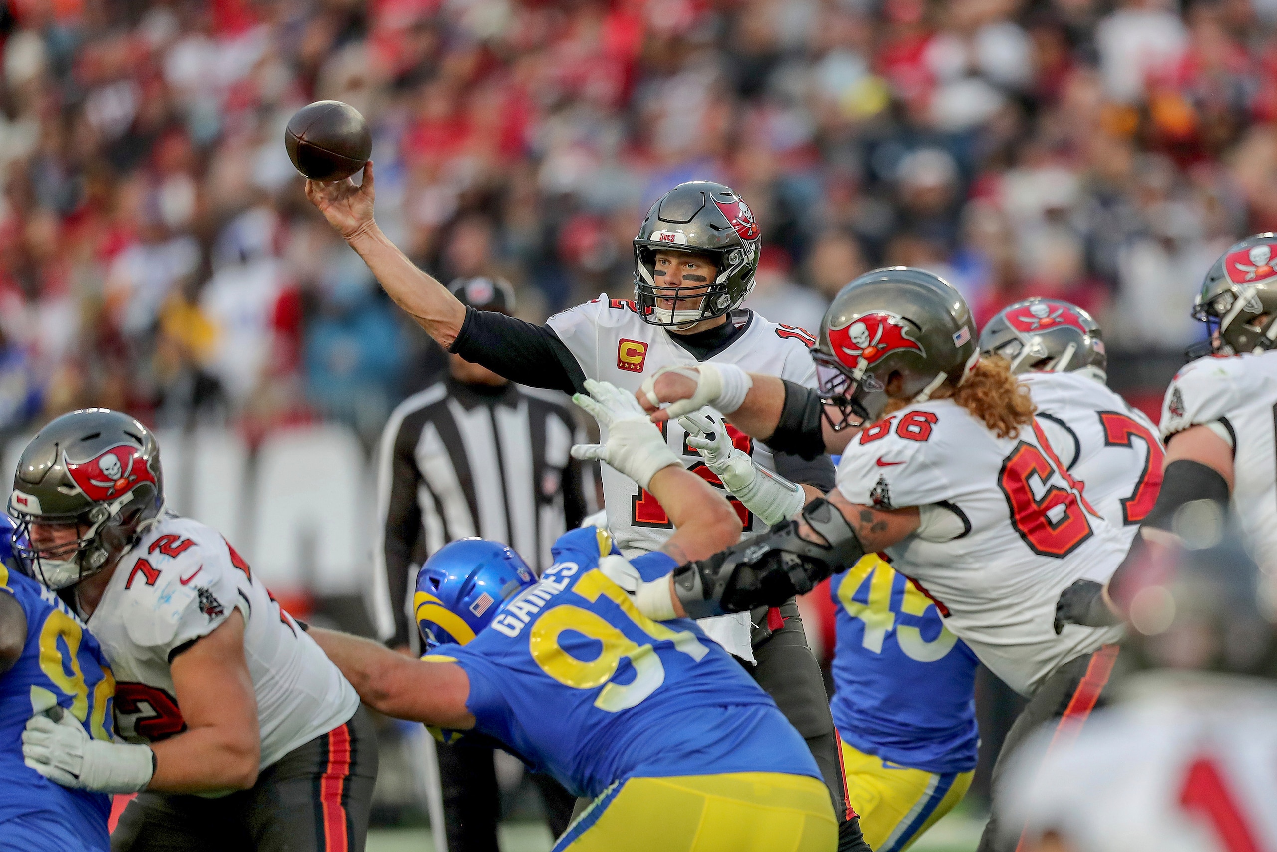 Tampa Bay Buccaneers quarterback Tom Brady (12) passes the ball during a NFL divisional playoff football game between the Los Angeles Rams and Tampa Bay Buccaneers, Sunday, January 23, 2022 in Tampa, Fla. (AP Photo/Alex Menendez)