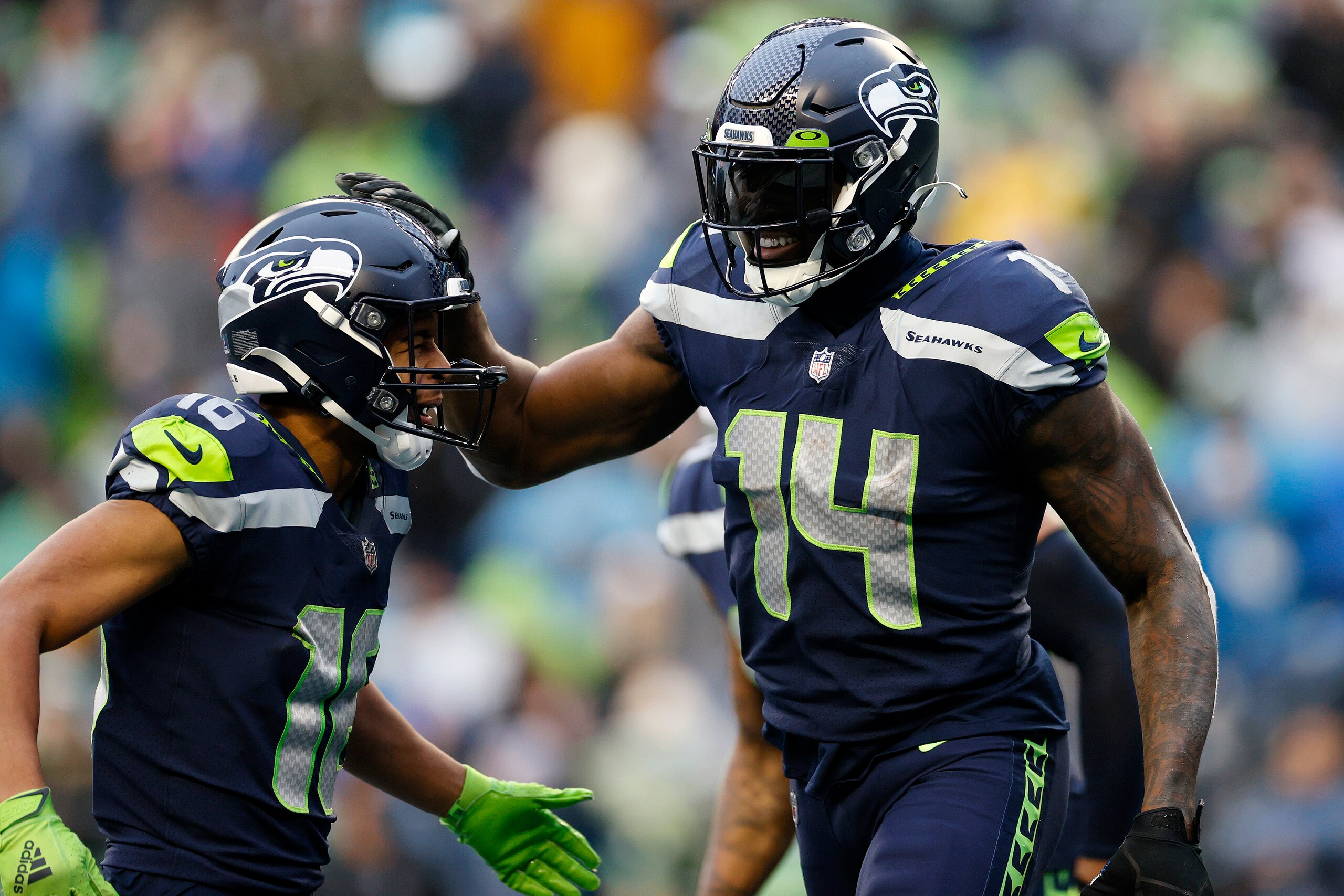 SEATTLE, WASHINGTON - JANUARY 02: DK Metcalf #14 of the Seattle Seahawks celebrates his touchdown catch with Tyler Lockett #16 during the third quarter against the Detroit Lions at Lumen Field on January 02, 2022 in Seattle, Washington. (Photo by Steph Chambers/Getty Images) SEATTLE, WASHINGTON - JANUARY 02: DK Metcalf #14 of the Seattle Seahawks celebrates his touchdown catch with Tyler Lockett #16 during the third quarter against the Detroit Lions at Lumen Field on January 02, 2022 in Seattle, Washington. (Photo by Steph Chambers/Getty Images)