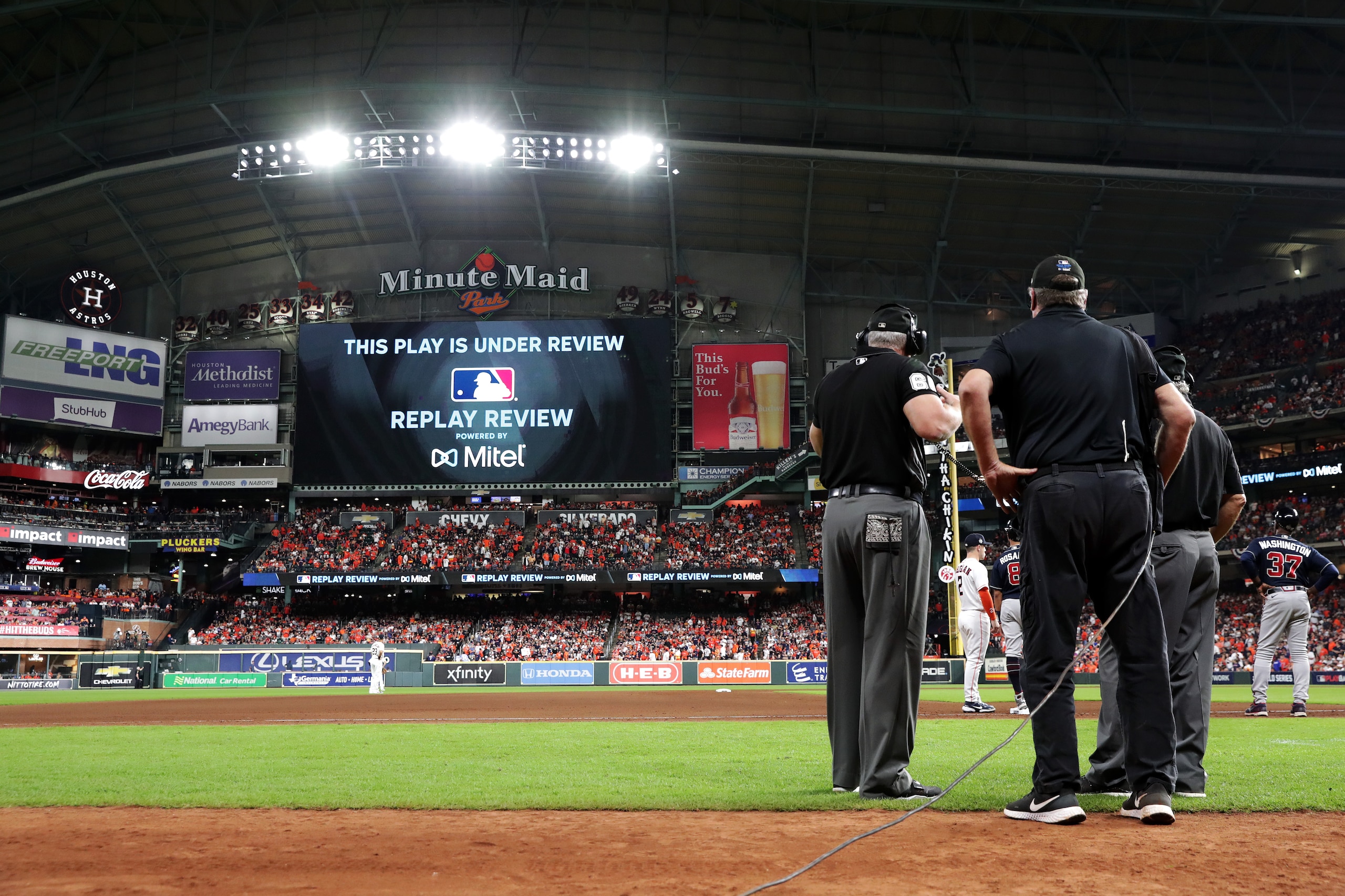 HOUSTON, TX - OCTOBER 26:  A general view of the field as the umpires review a play in the seventh inning during Game 1 of the 2021 World Series between the Atlanta Braves and the Houston Astros at Minute Maid Park on Tuesday, October 26, 2021 in Houston, Texas. (Photo by Mary DeCicco/MLB Photos via Getty Images)