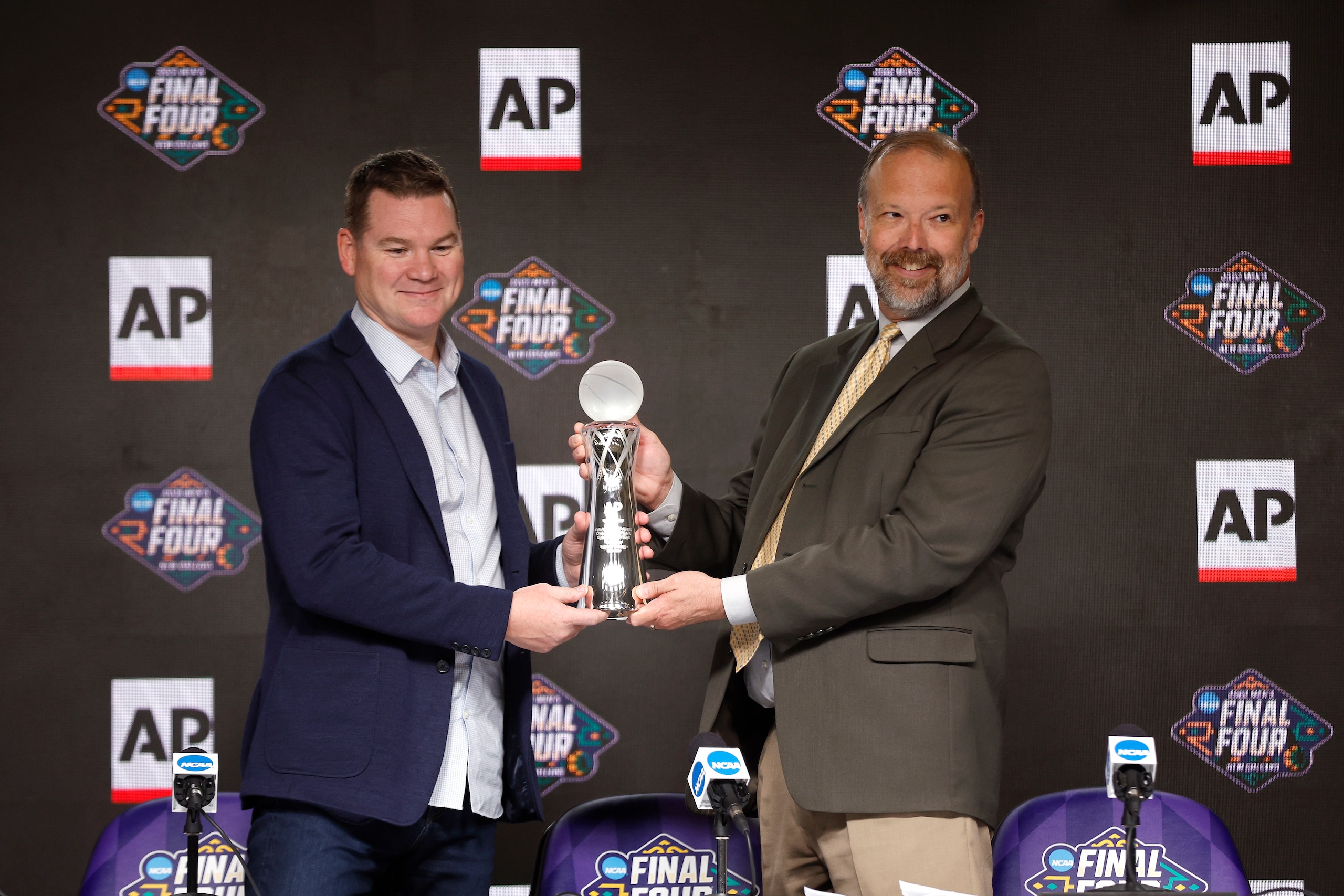 NEW ORLEANS, LOUISIANA - APRIL 01: Head coach Tommy Lloyd of the Arizona Wildcats is presented with the AP Coach of the Year Award during a press conference before the 2022 Men's Basketball Tournament Final Four at Caesars Superdome on April 01, 2022 in New Orleans, Louisiana. (Photo by Chris Graythen/Getty Images)