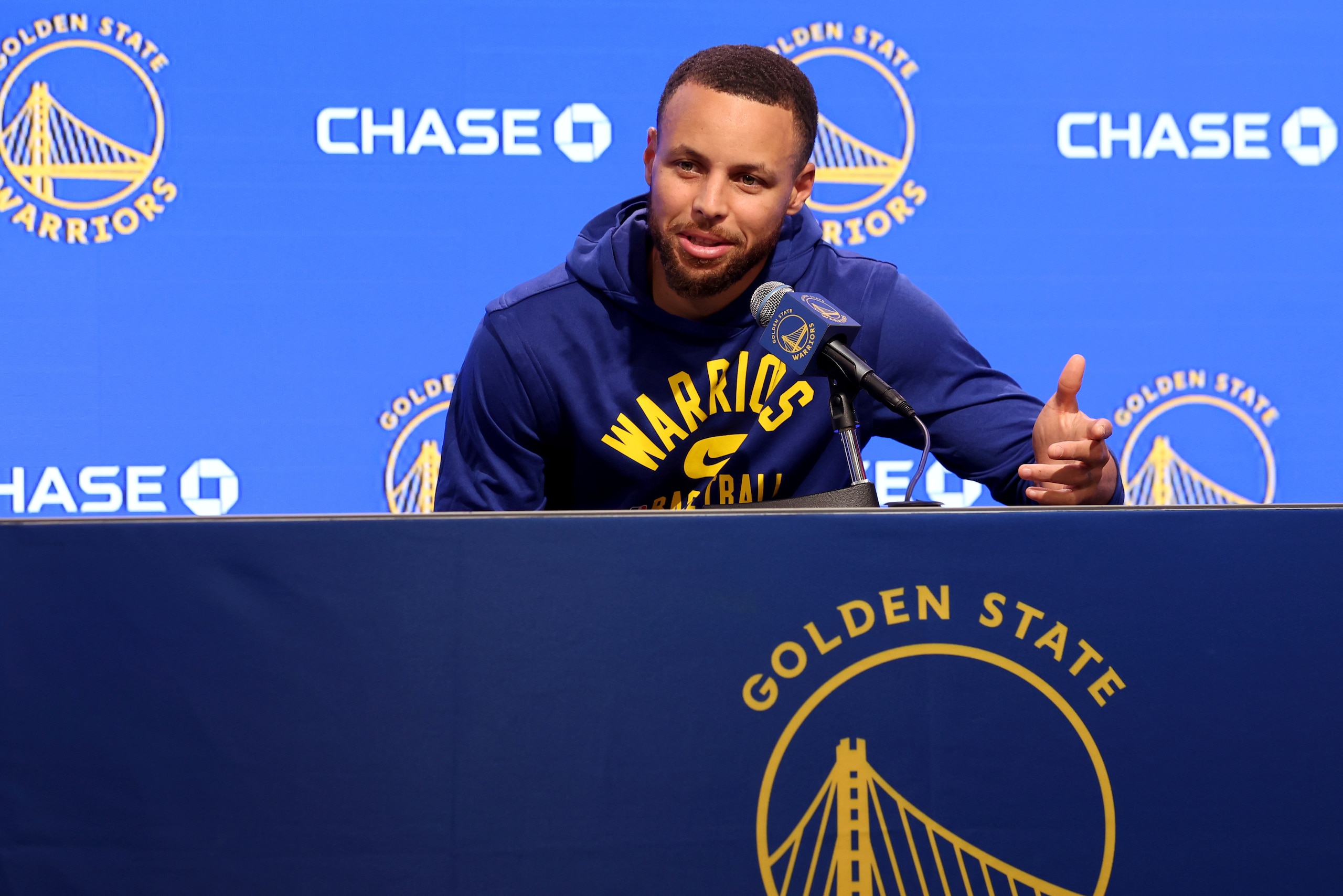 Golden State Warriors guard Stephen Curry talks to the media about his injury before an NBA basketball game against the San Antonio Spurs in San Francisco, Sunday, March 20, 2022. (AP Photo/Jed Jacobsohn, Pool)