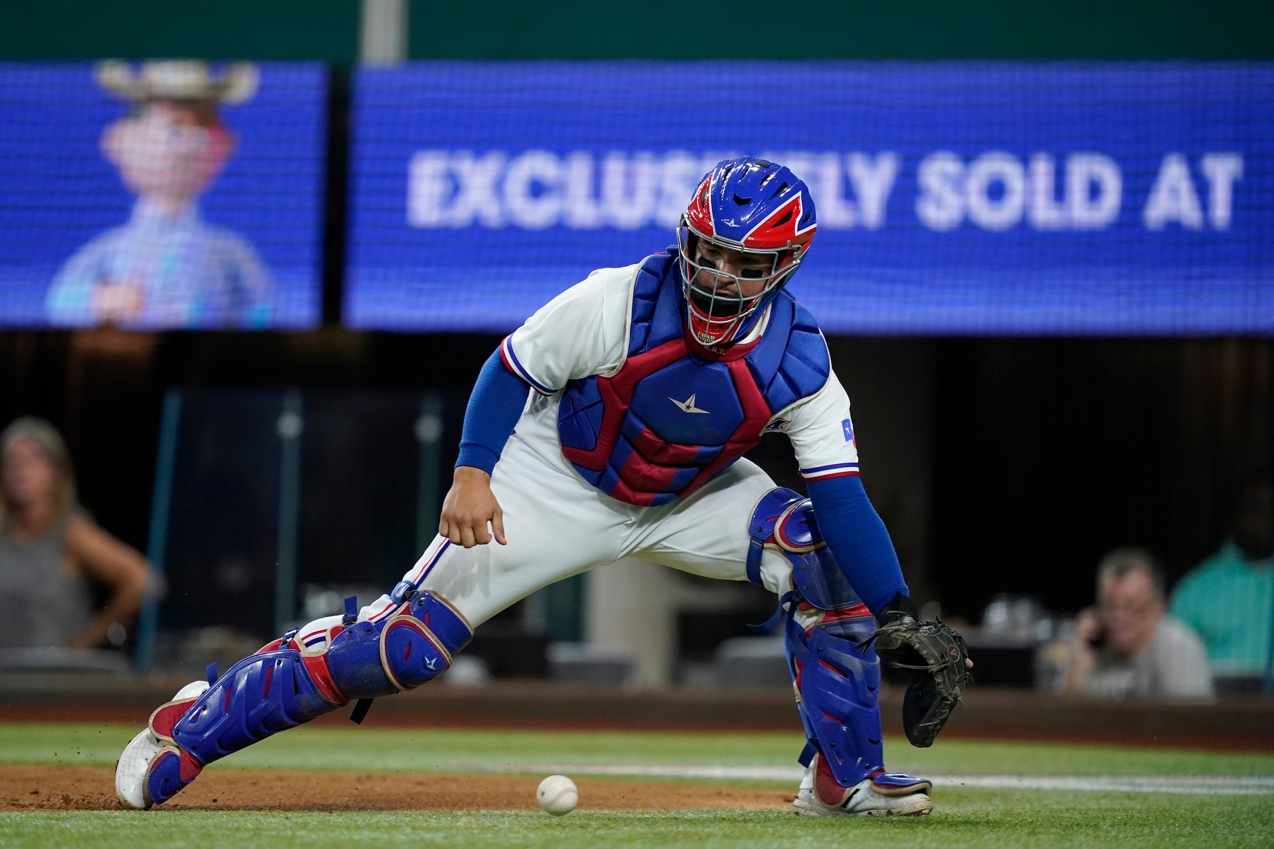 Texas Rangers catcher Jose Trevino reaches down to catch a throw to the plate during a baseball game against the Los Angeles Angels in Arlington, Texas, Wednesday, Sept. 29, 2021. (AP Photo/Tony Gutierrez) Texas Rangers catcher Jose Trevino reaches down to catch a throw to the plate during a baseball game against the Los Angeles Angels in Arlington, Texas, Wednesday, Sept. 29, 2021. (AP Photo/Tony Gutierrez)